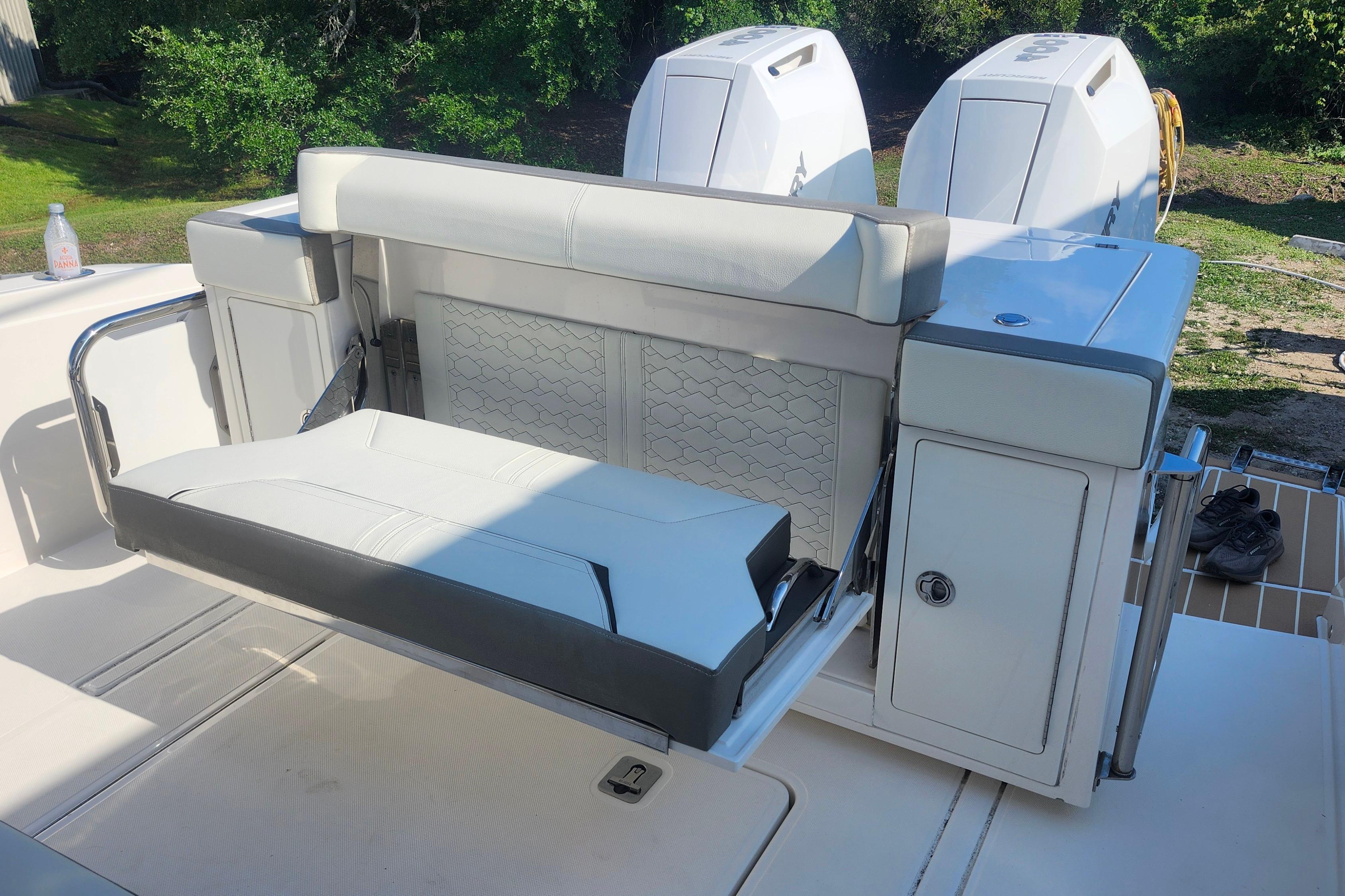 2024 Tiara Yachts 34 LS boat with foldable seating and dual outboard engines.