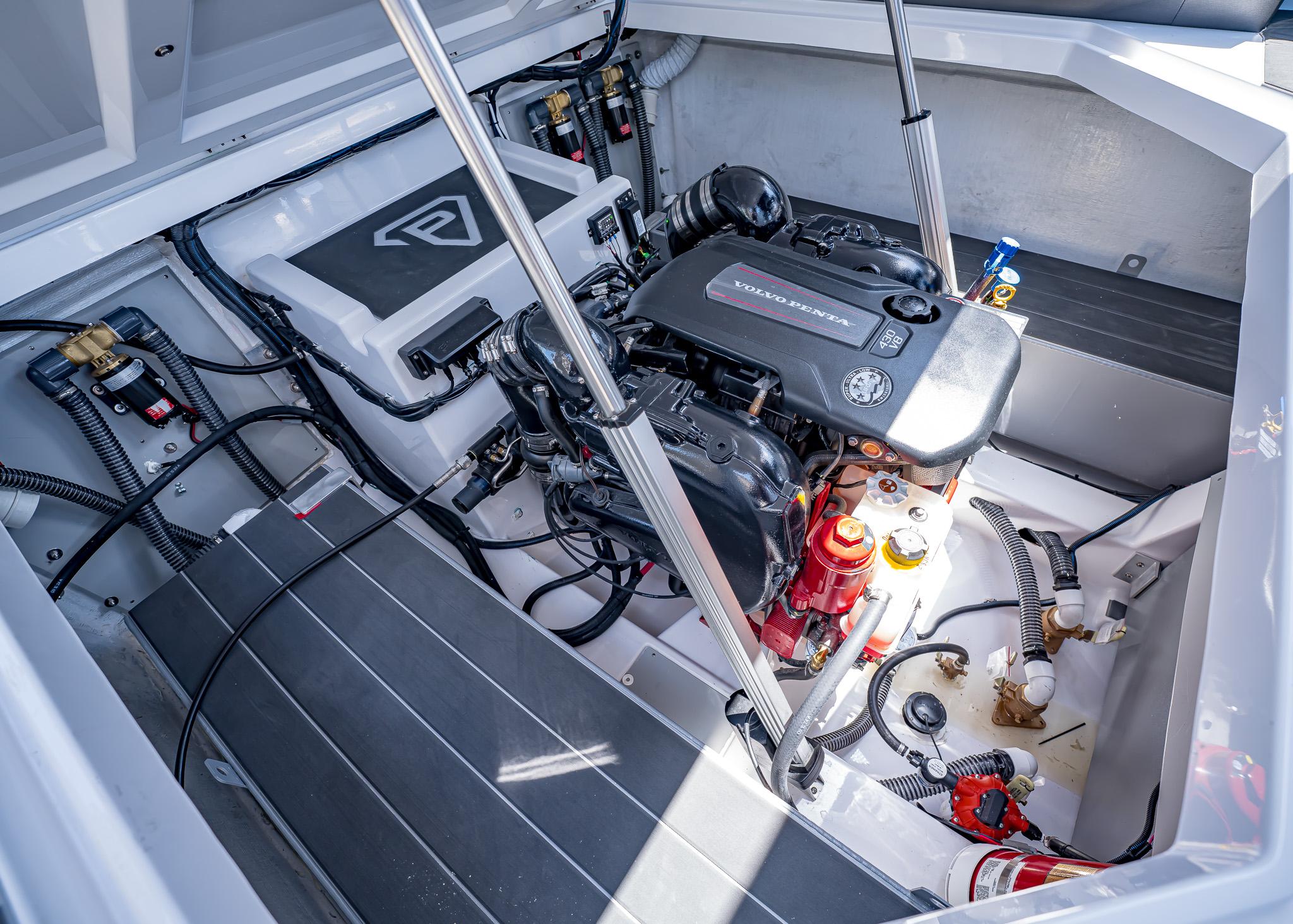 Engine compartment of 2025 Paradigm Damascus 266 Surf boat, featuring Volvo Penta engine.