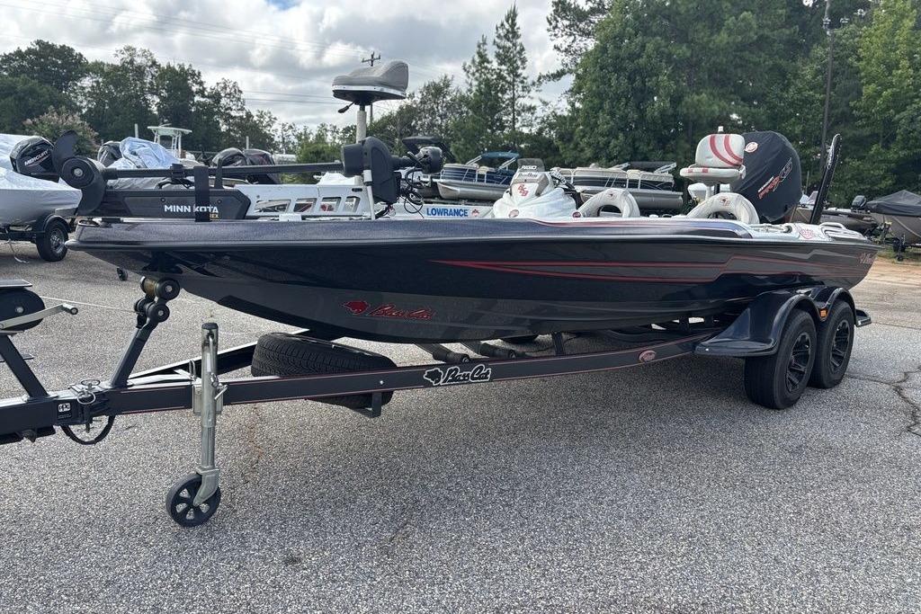 2020 Bass Cat Cougar FTD boat on trailer, equipped with Minn Kota and Lowrance systems.