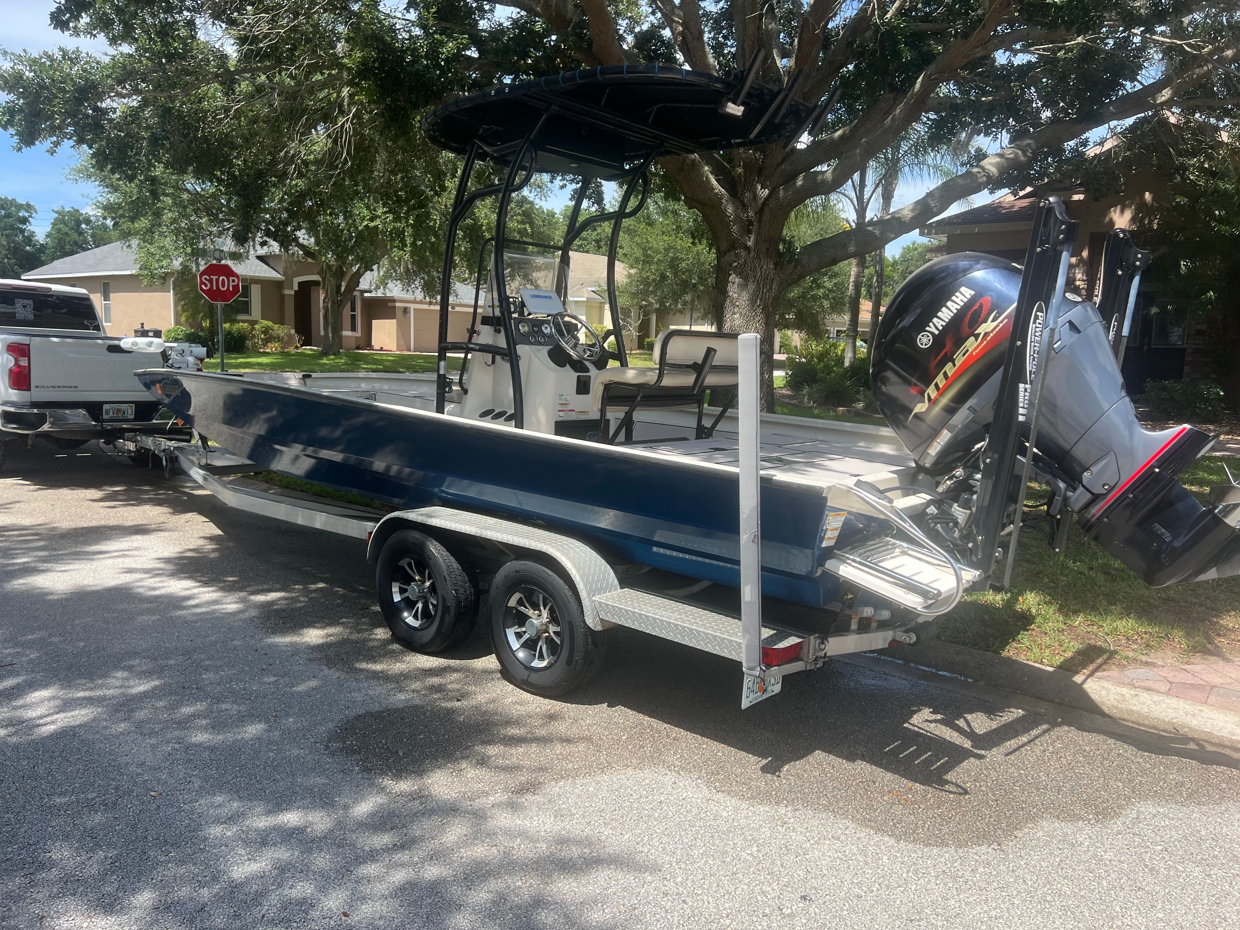 2016 Xpress H24B Bay boat on trailer, ready for transport.