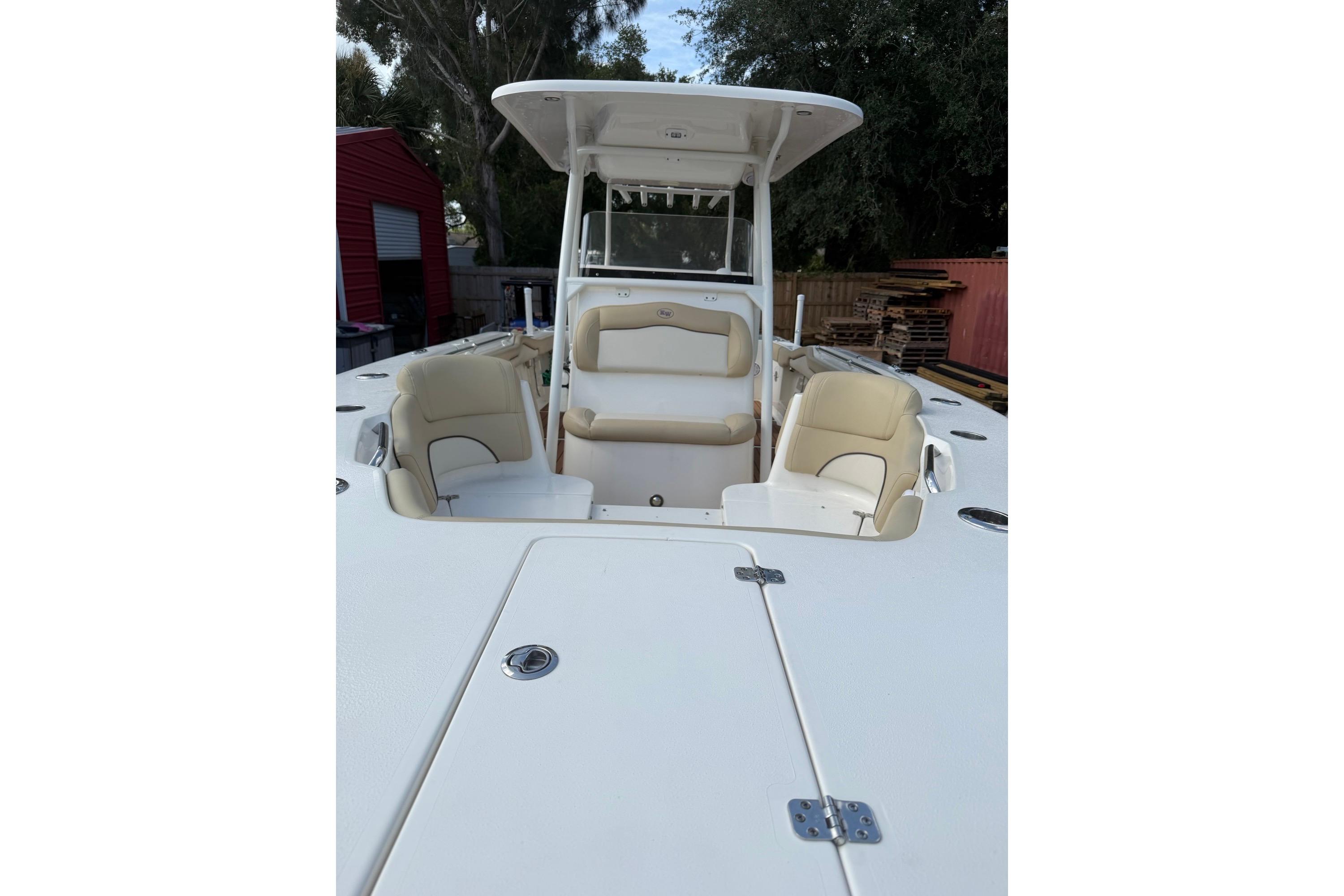 2019 Key West 263 FS boat interior with beige seating and center console.