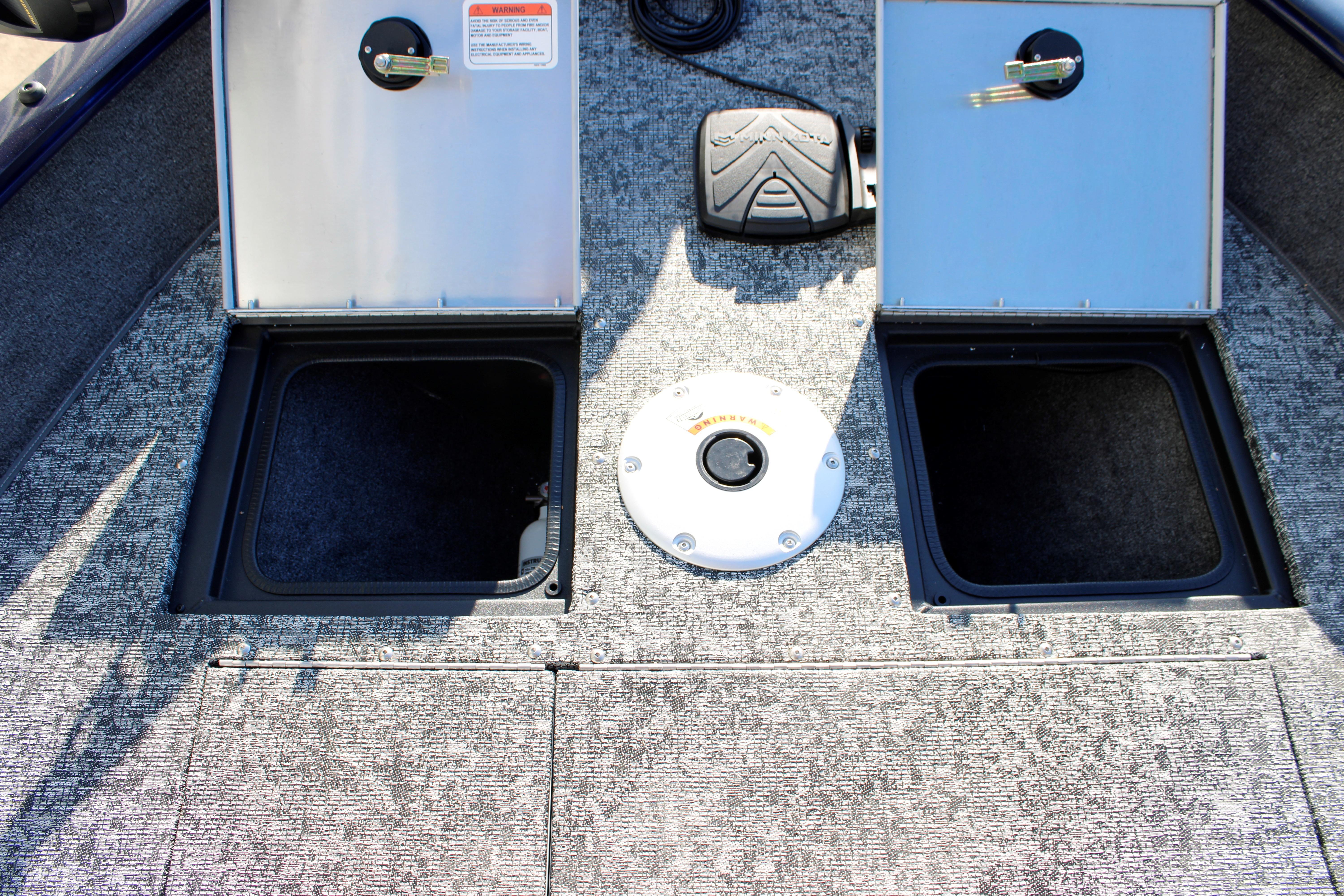 2026 Tracker Pro Guide V-16 SC boat storage compartments open on deck.
