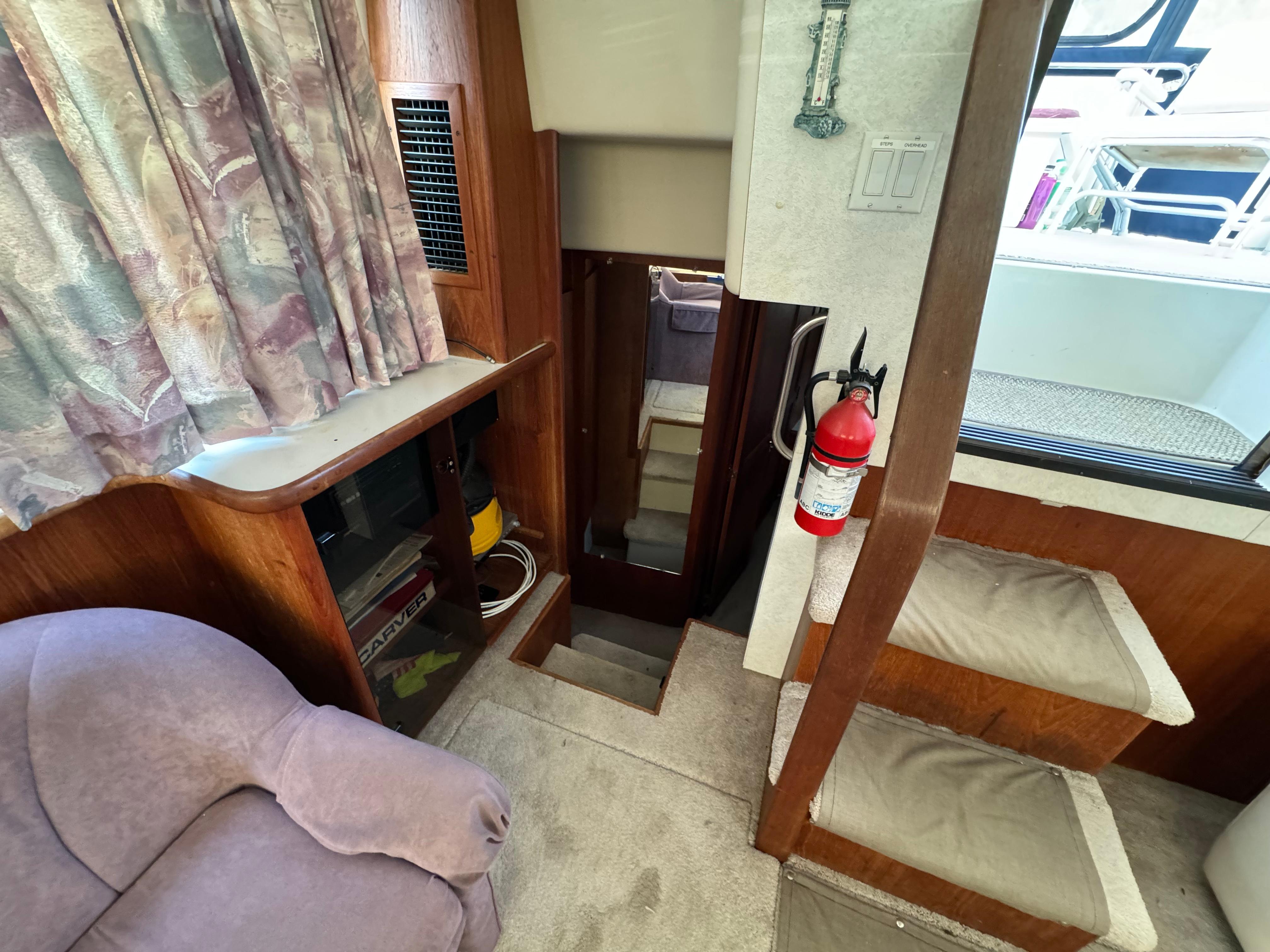 Interior of 1991 Carver 33 Aft Cabin with stairs and seating area.