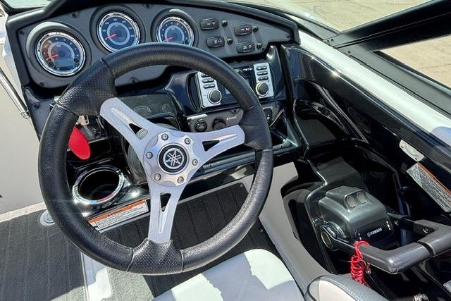 2014 Yamaha Boats 212X dashboard with steering wheel and control panel.