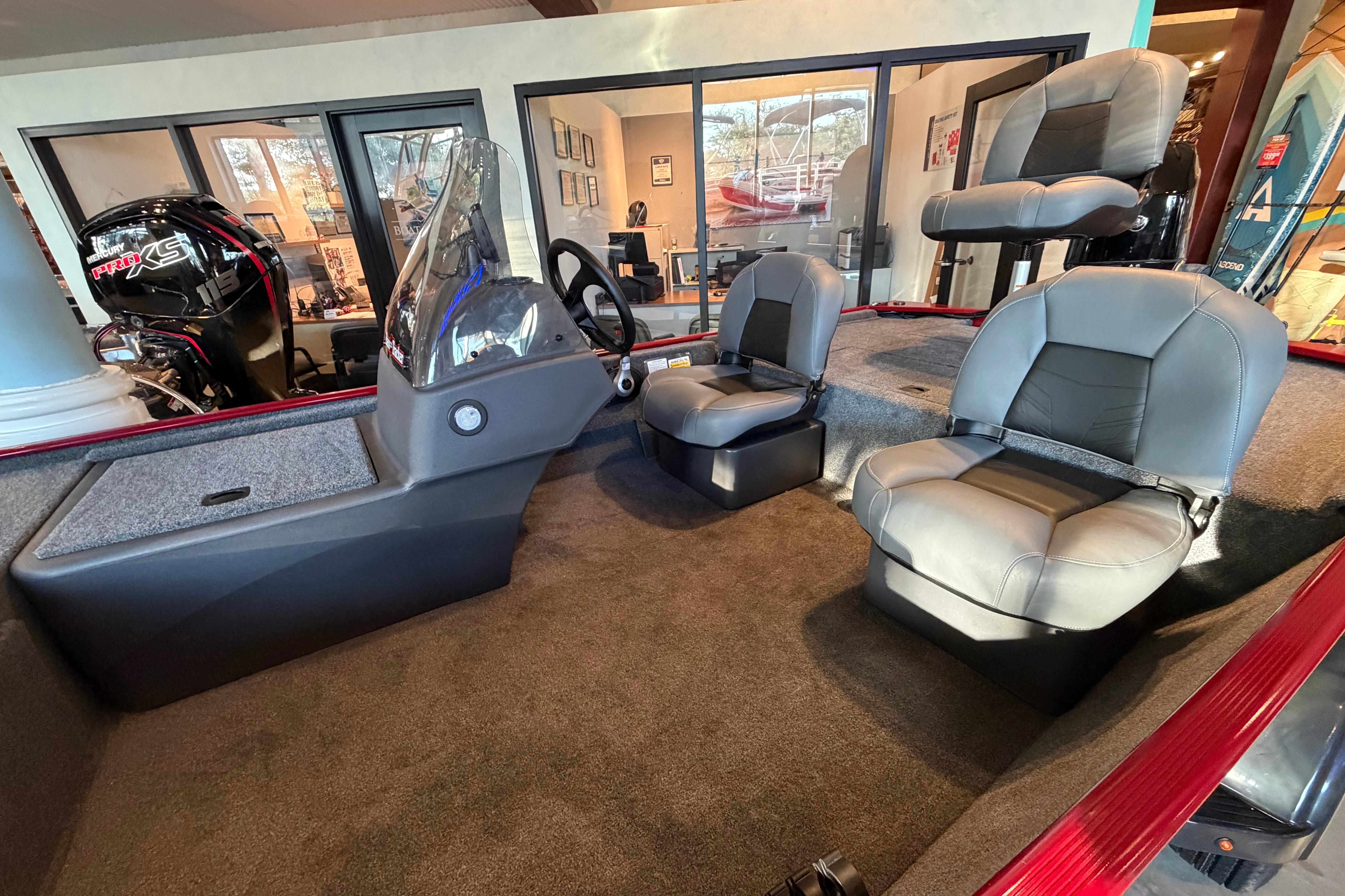 2026 Tracker Bass Tracker Classic XL boat interior with seating and steering console.