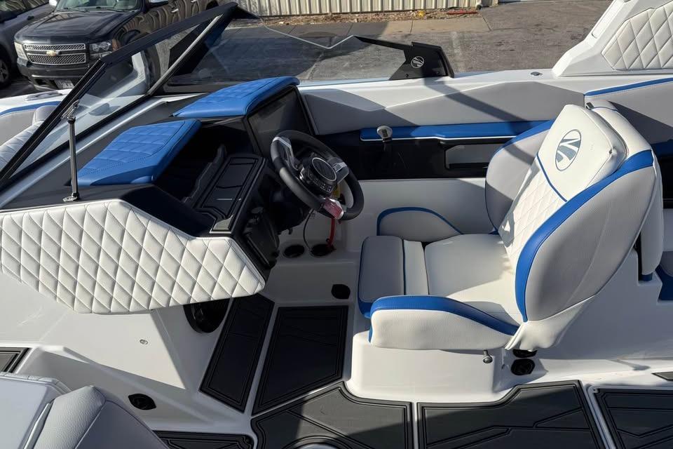 2026 Tigé Z3 boat interior with blue and white seating and modern dashboard.