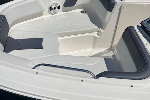 2015 Chaparral 21 H2O Sport boat interior with cushioned seating and speaker.