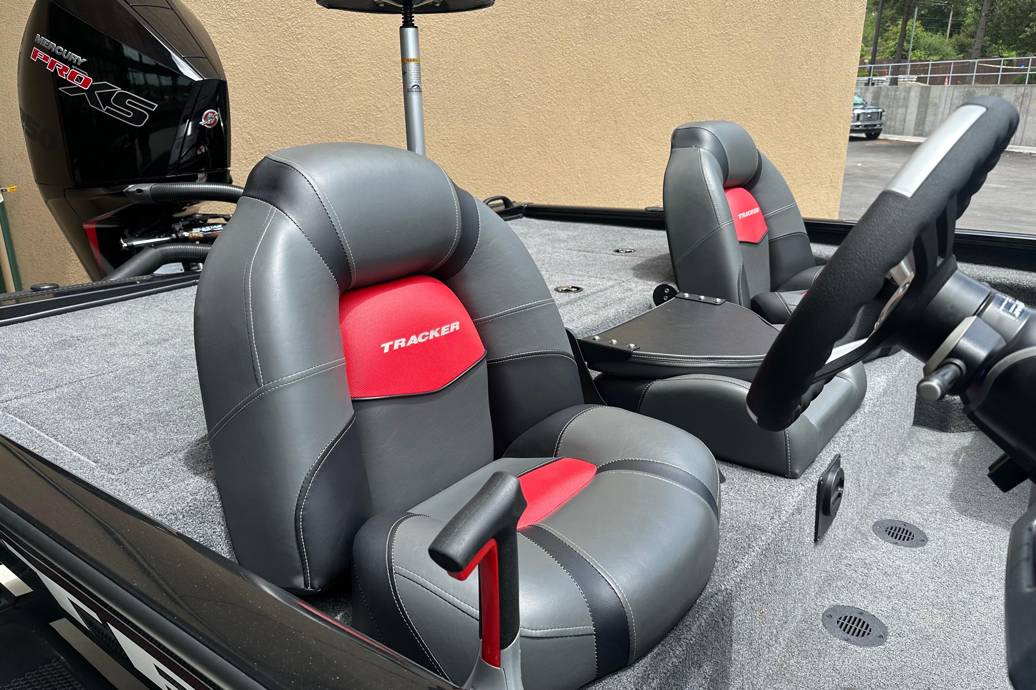 2025 Tracker Savage 215 boat interior with gray and red seats, Mercury Pro XS engine.