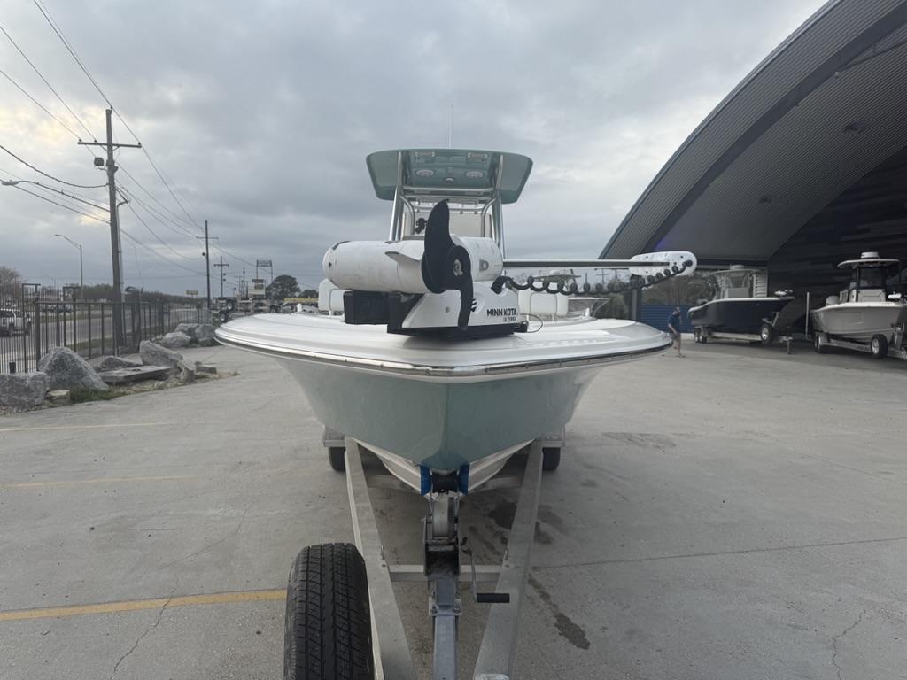 2017 ShearWater 270 Carolina Flare boat on trailer, parked outdoors under cloudy sky.