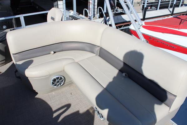 2024 Sun Tracker BB18 boat interior with beige seating and speaker.