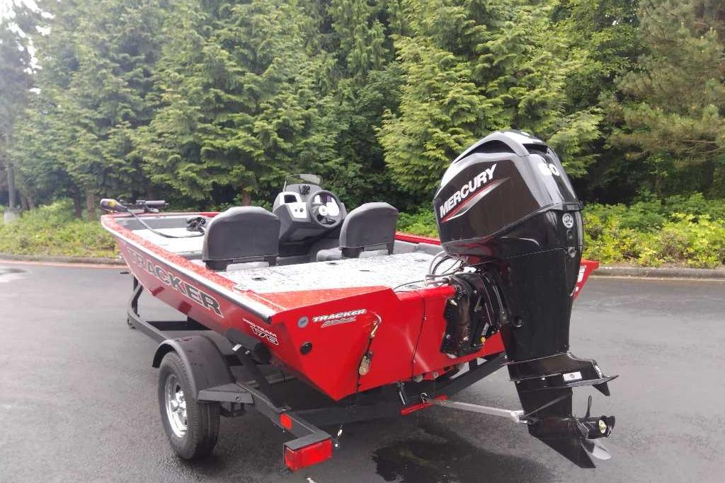 2026 Tracker Pro Team 175 Crappie Edition boat with Mercury engine, parked outdoors.
