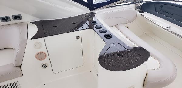 2010 Meridian 441 Sedan yacht interior with sleek seating and modern design.