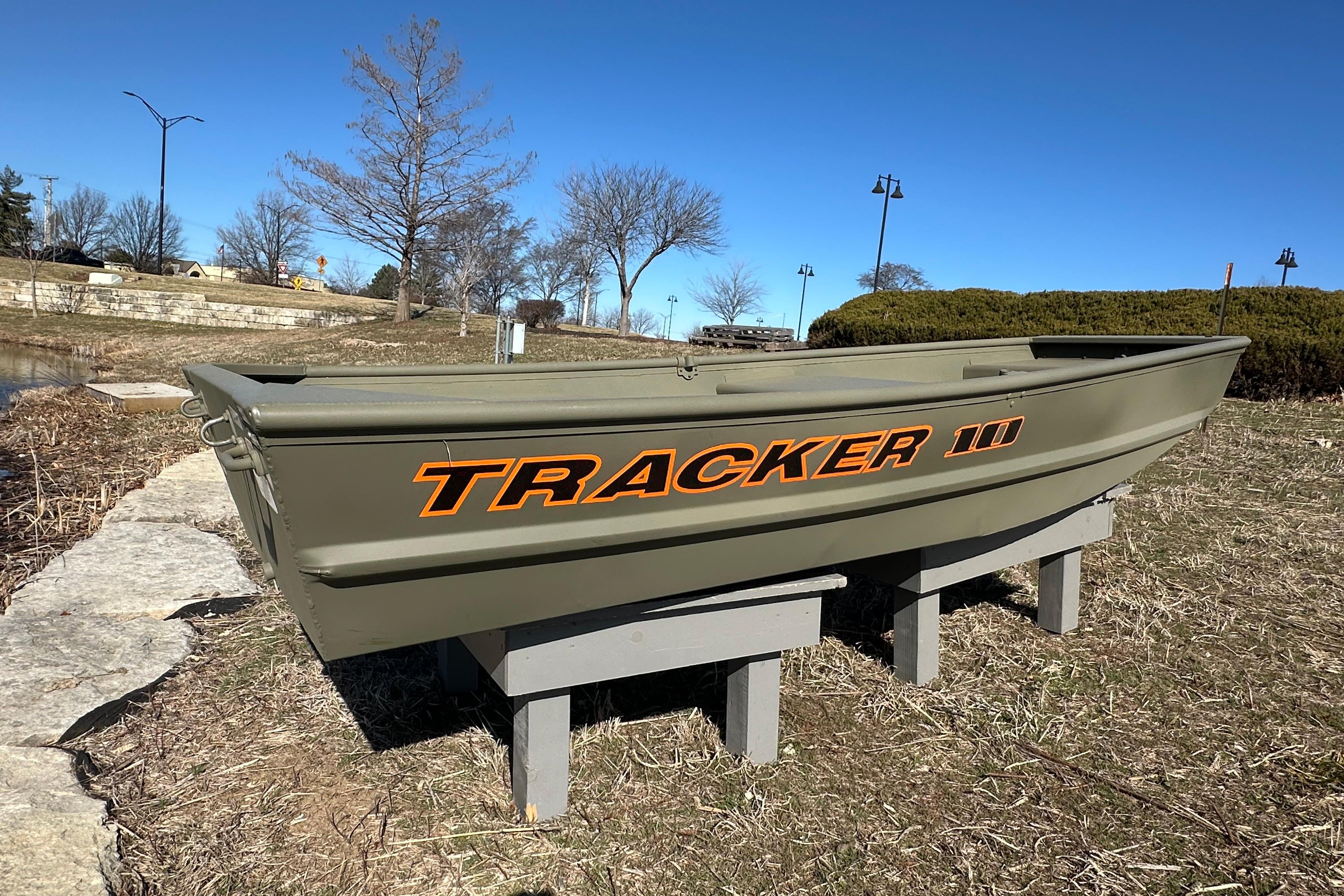 2026 Tracker Grizzly 10 Jon boat displayed outdoors on a sunny day.