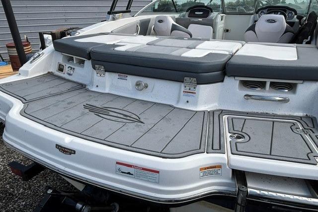 2021 Chaparral 21 SSi boat with spacious rear deck and seating area.