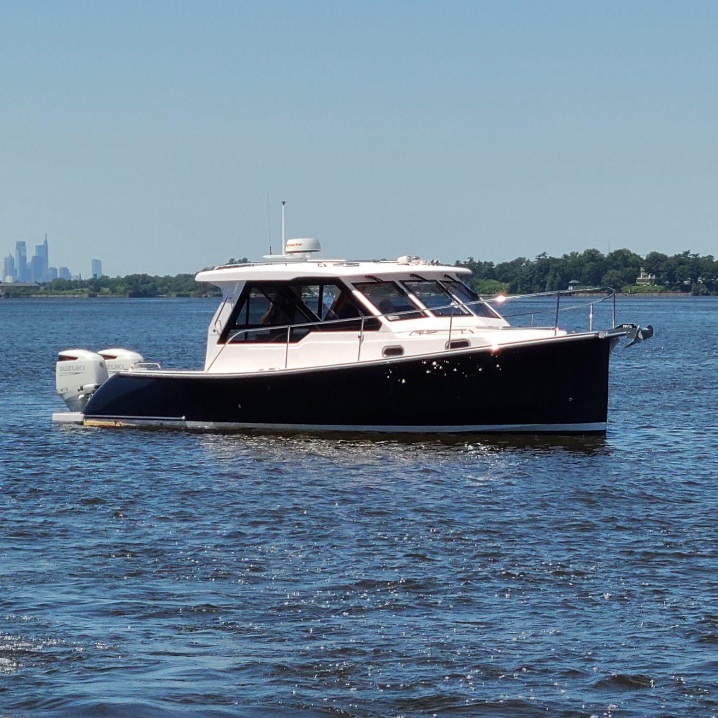 2024 True North 34 boat cruising on a sunny day.