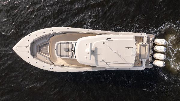 Aerial view of 2025 Scout 425 LXF boat cruising on water.