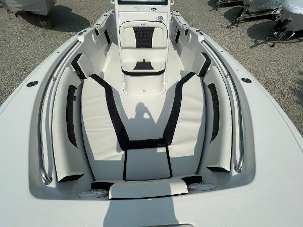 2025 Tidewater 232 CC Adventure boat interior with cushioned seating and sleek design.