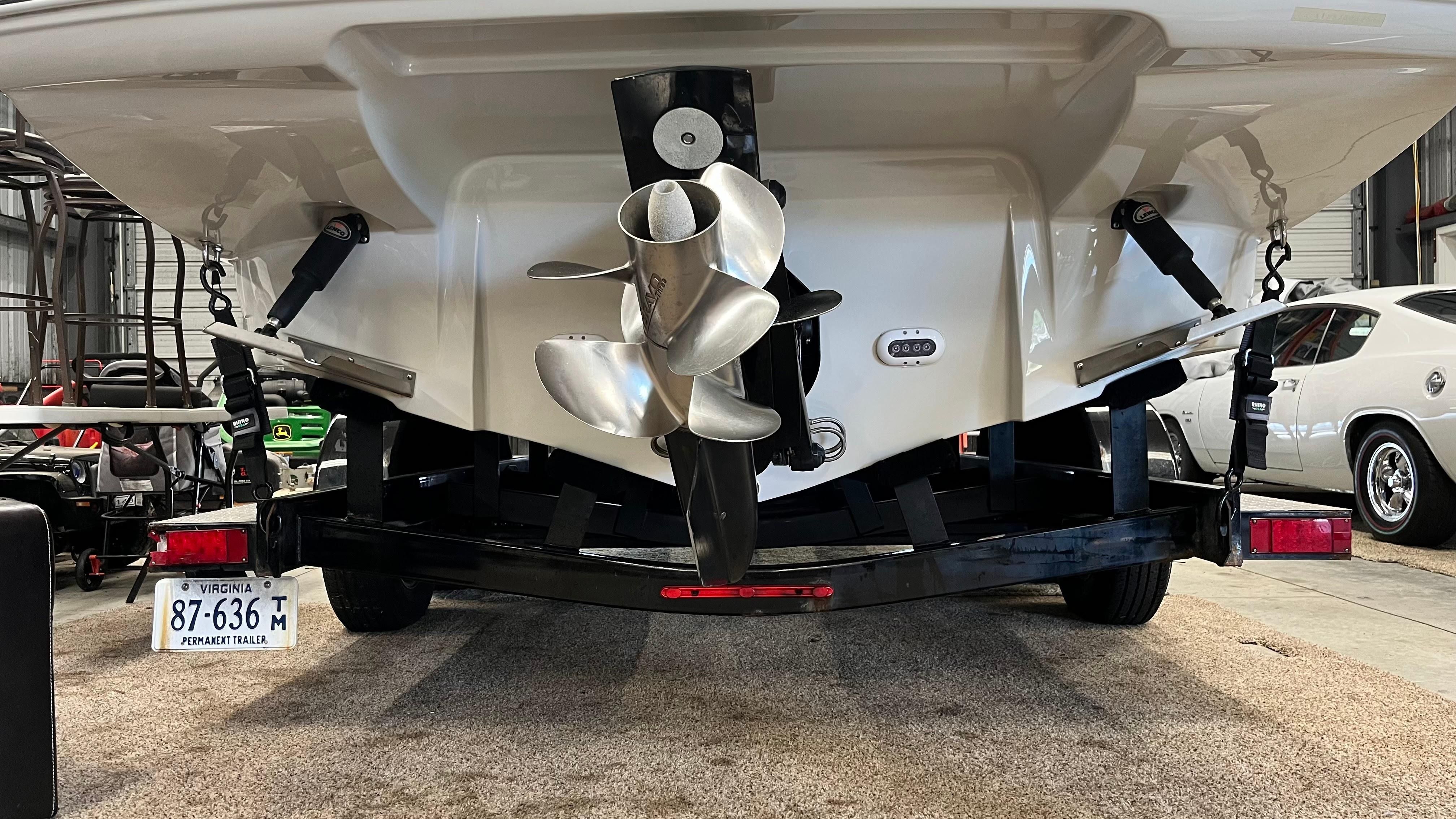 The image shows the stern of a Crownline E 285 boat with a propeller.