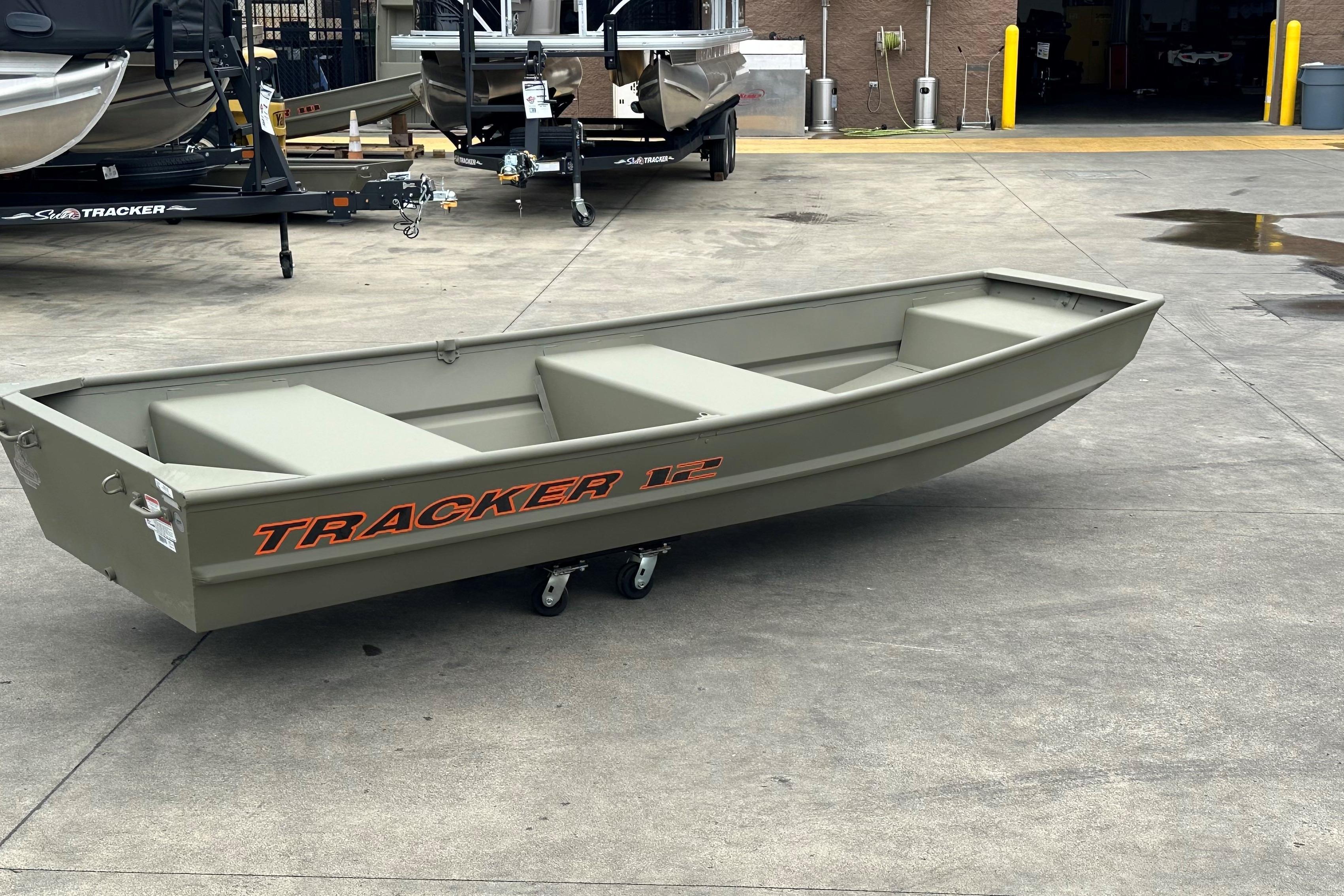 2026 Tracker Grizzly 12 Jon boat on concrete surface, showcasing sturdy design.