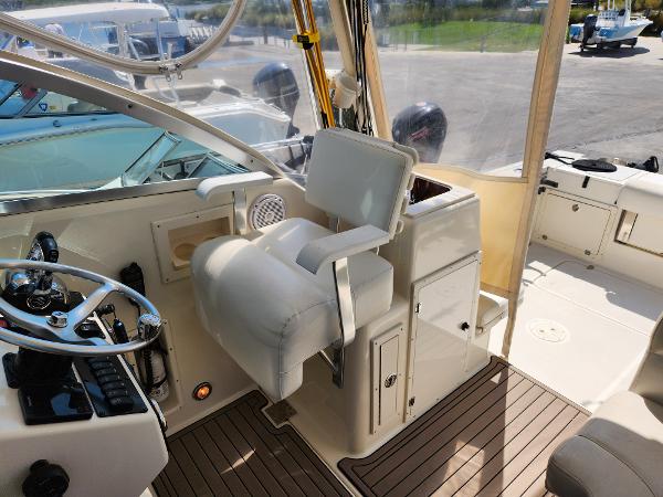 2005 Pursuit 3070 Offshore Center Console boat interior with helm and seating area.