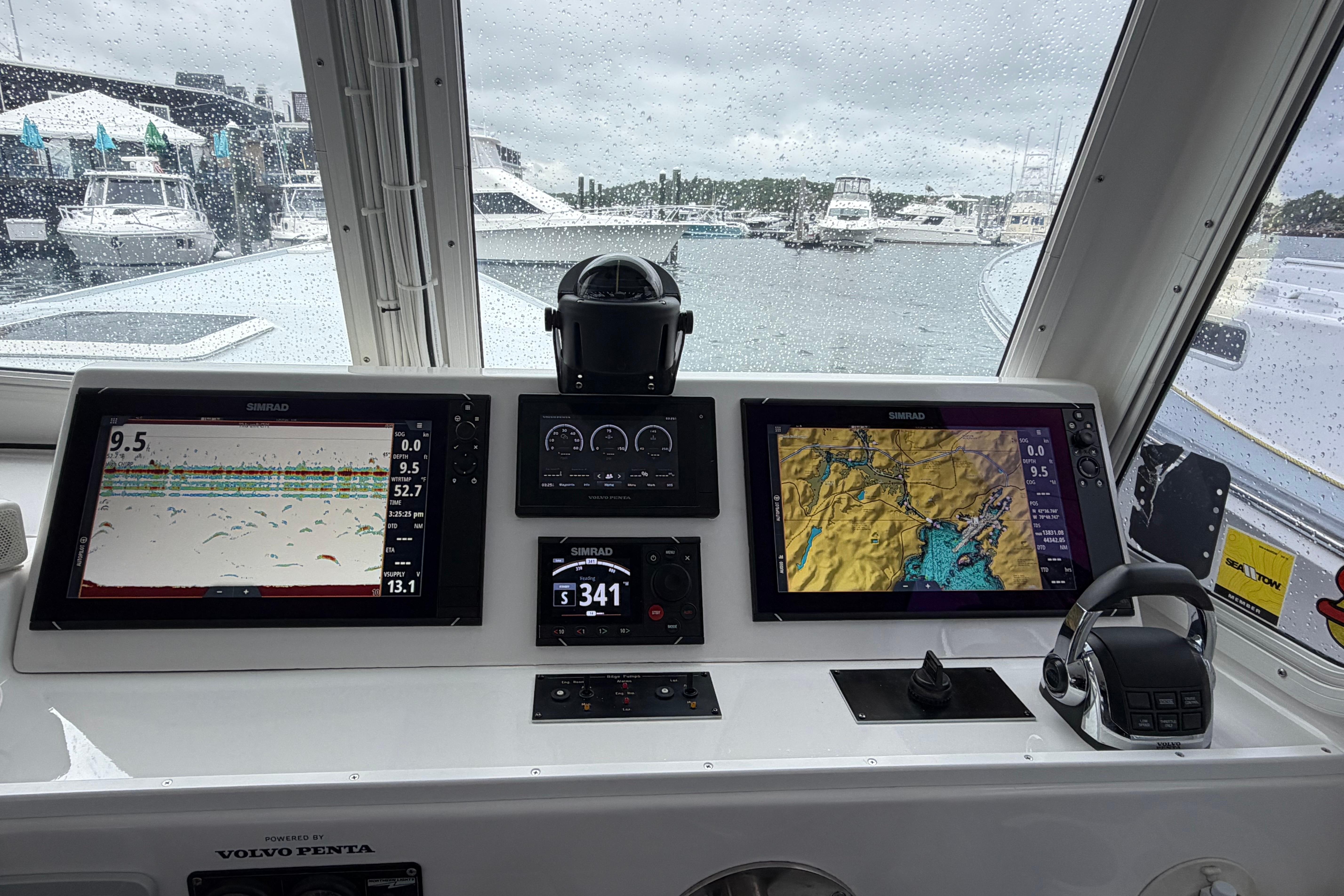 Helm of 2018 H&H Marine Osmond Beal boat with navigation displays and controls.