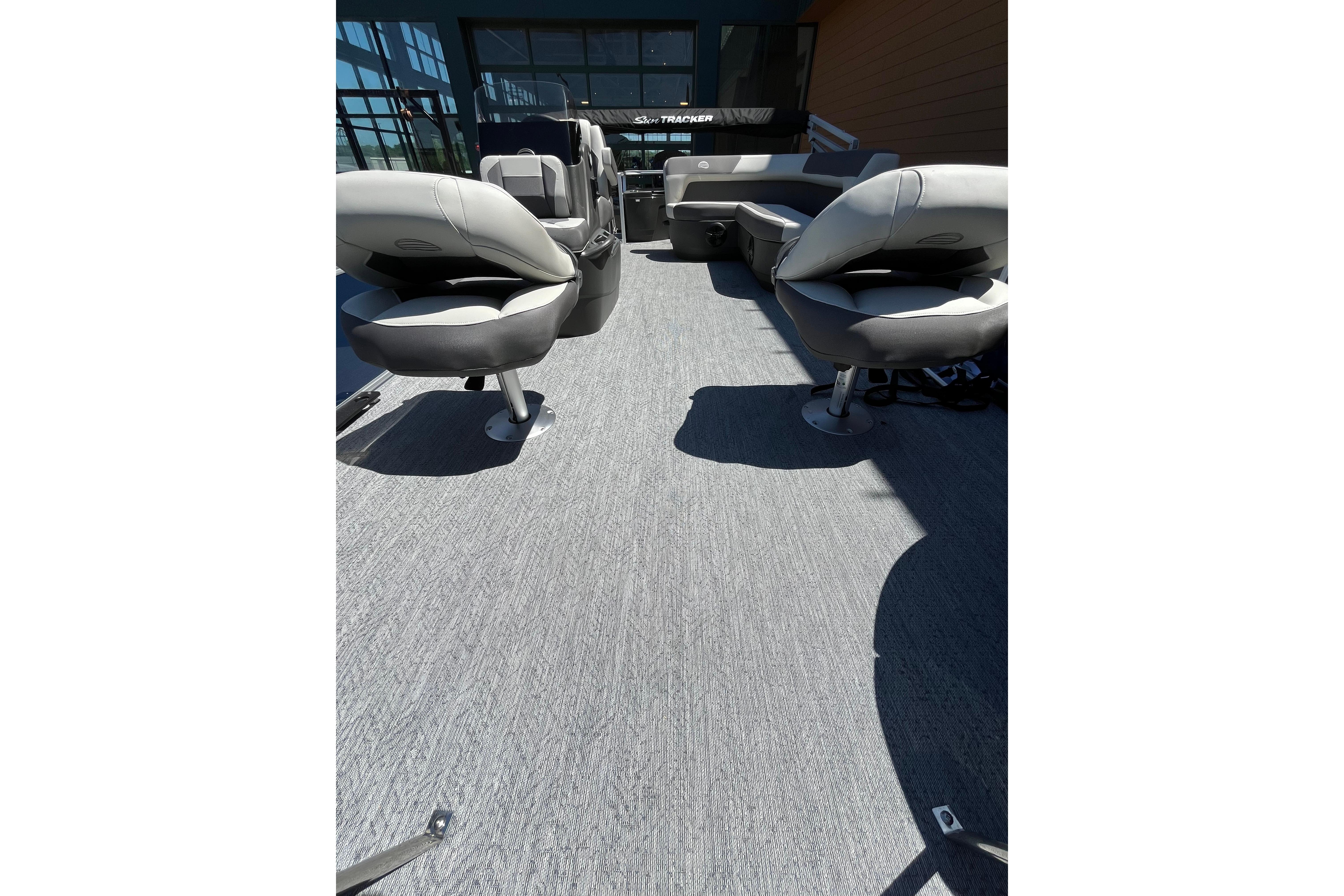 2026 Sun Tracker Bass Buggy 18 DLX interior with comfortable seating and spacious deck.