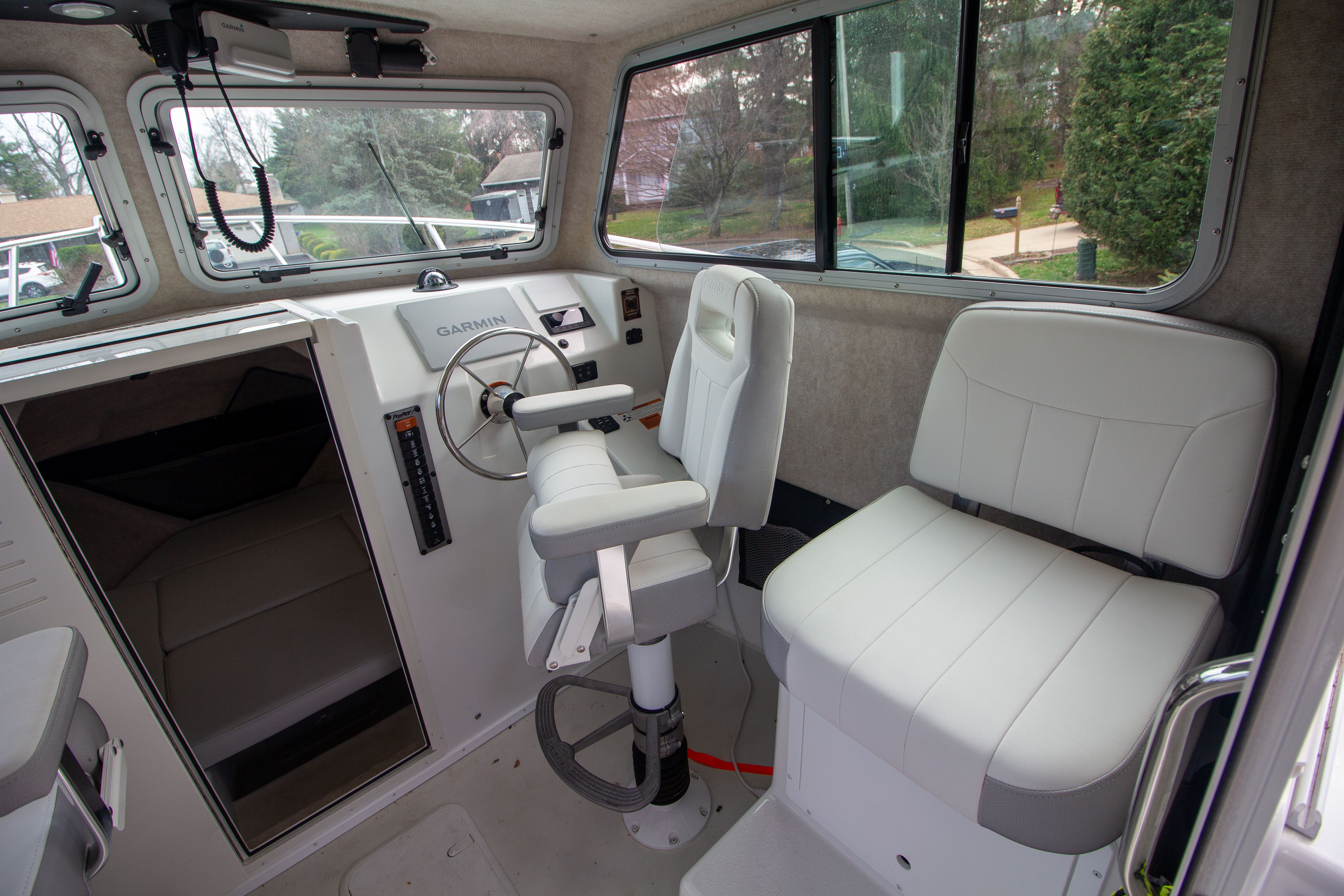 Interior of 2022 Parker 2520 XLD Sport Cabin with helm station.
