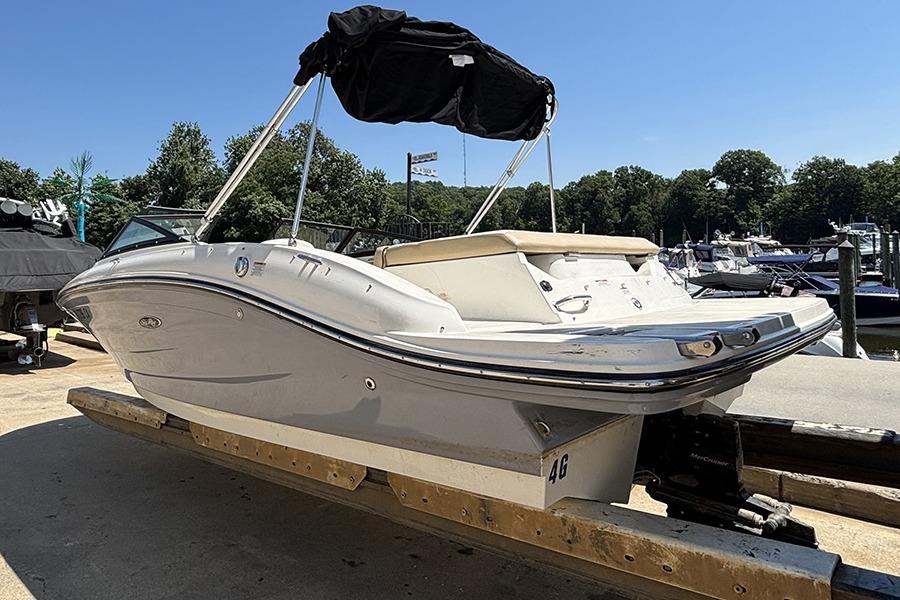 2018 Sea Ray SPX 190 boat on trailer at marina, sunny day.