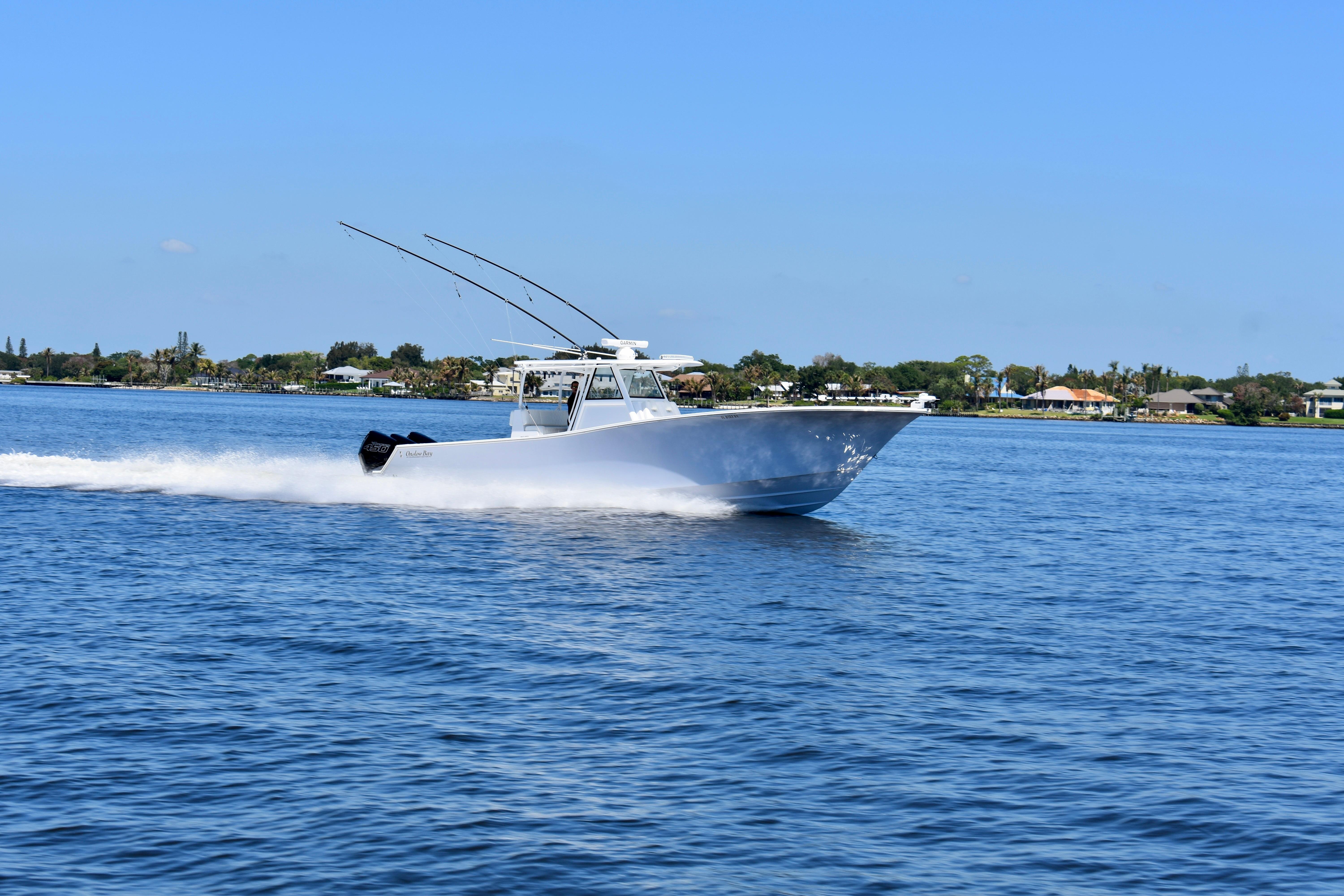 2022 Onslow Bay 41 Tournament boat cruising on a sunny day in open water.