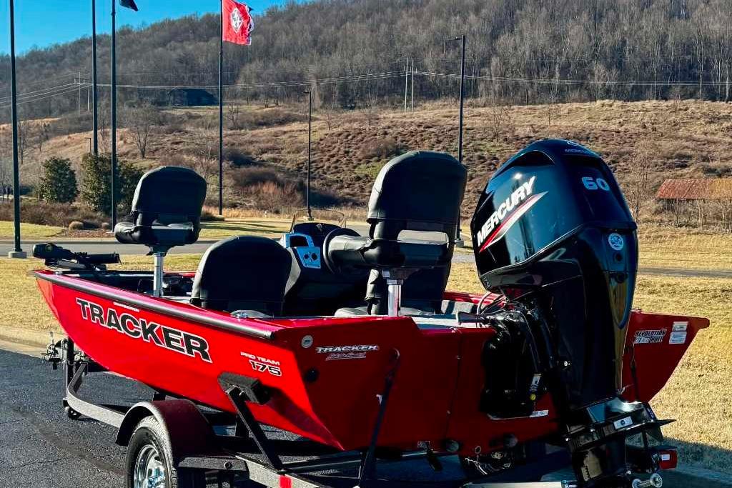 2026 Tracker Pro Team 175 Crappie Edition boat with Mercury engine, parked outdoors.
