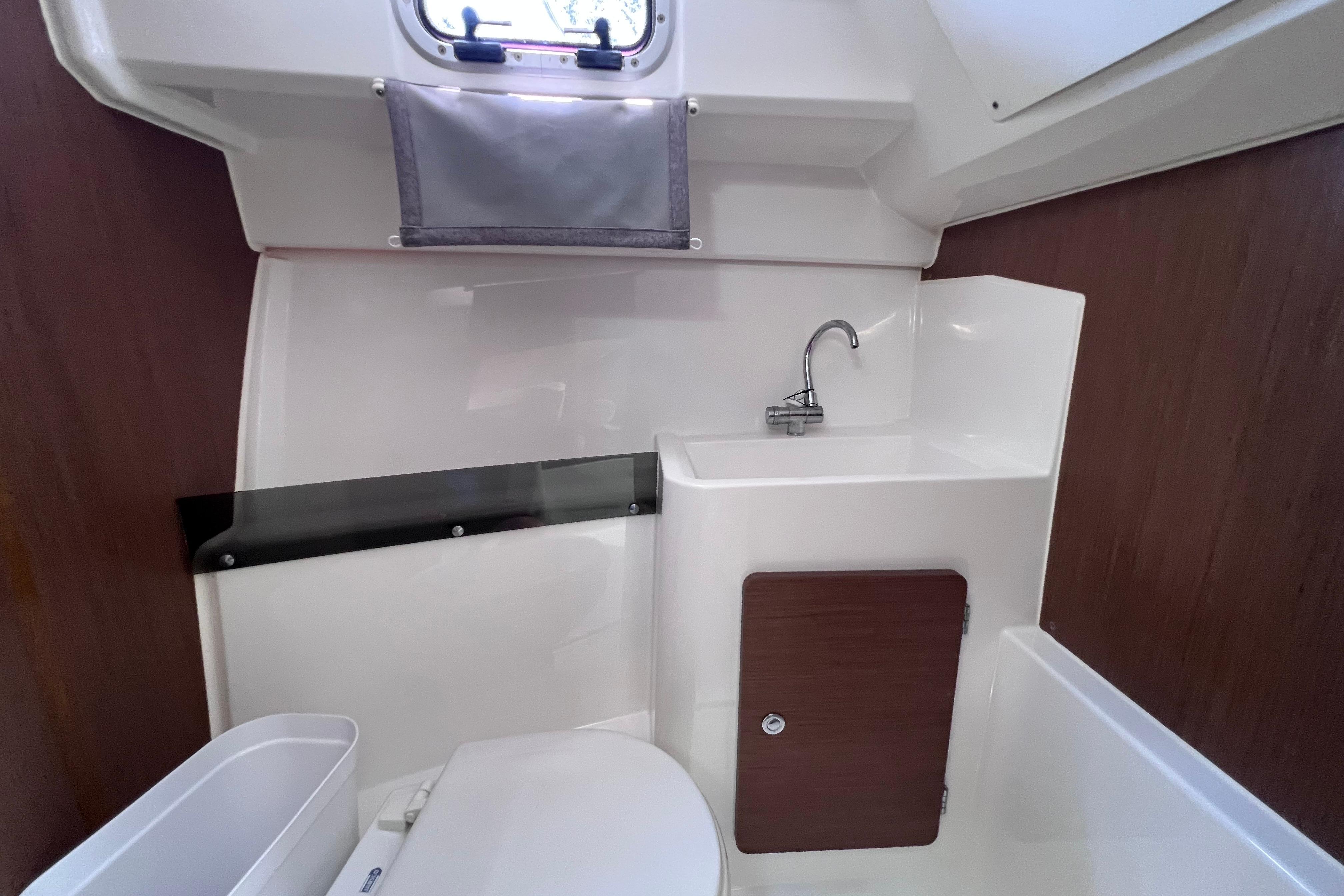 2021 Jeanneau NC Weekender 795 Series 2 boat bathroom with sink and toilet.