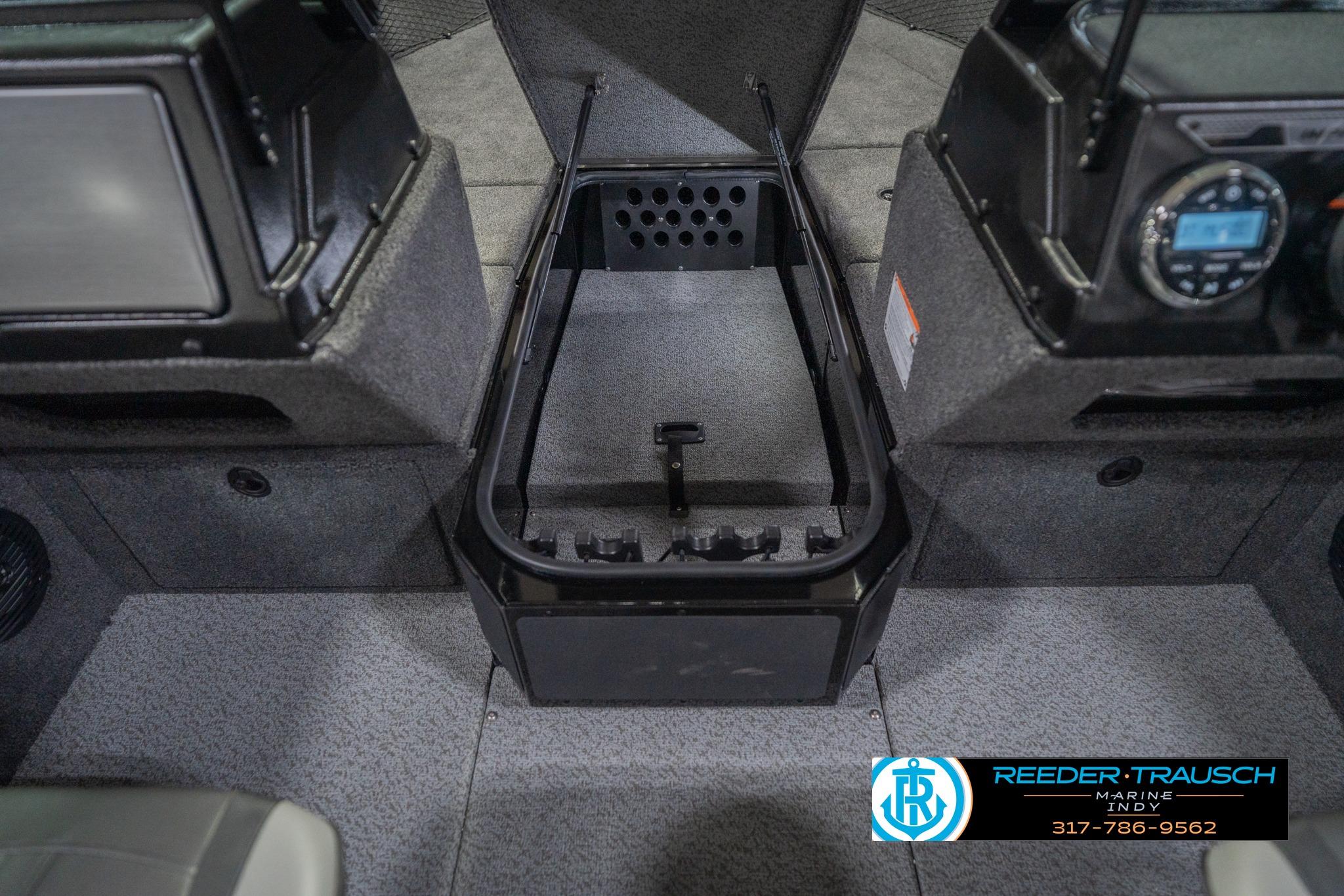 2026 Lund 2075 Impact XS boat interior with storage compartment and control panel.