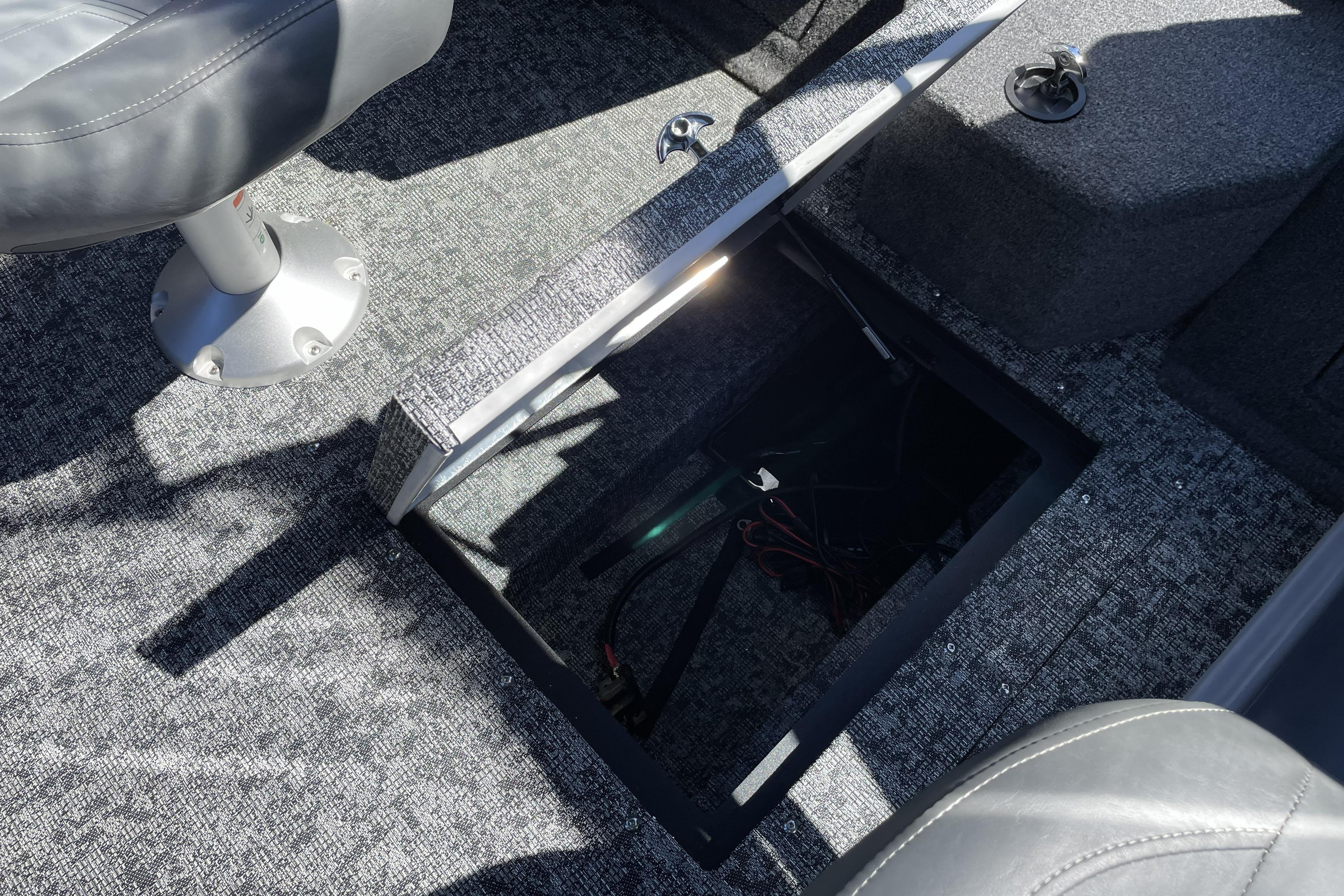 Open storage compartment in 2026 Tracker Targa V-18 WT boat interior.