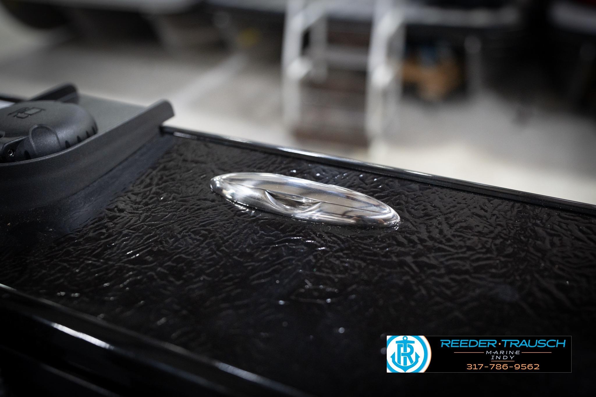 2026 Lund 2275 Baron boat detail with textured surface and chrome handle.