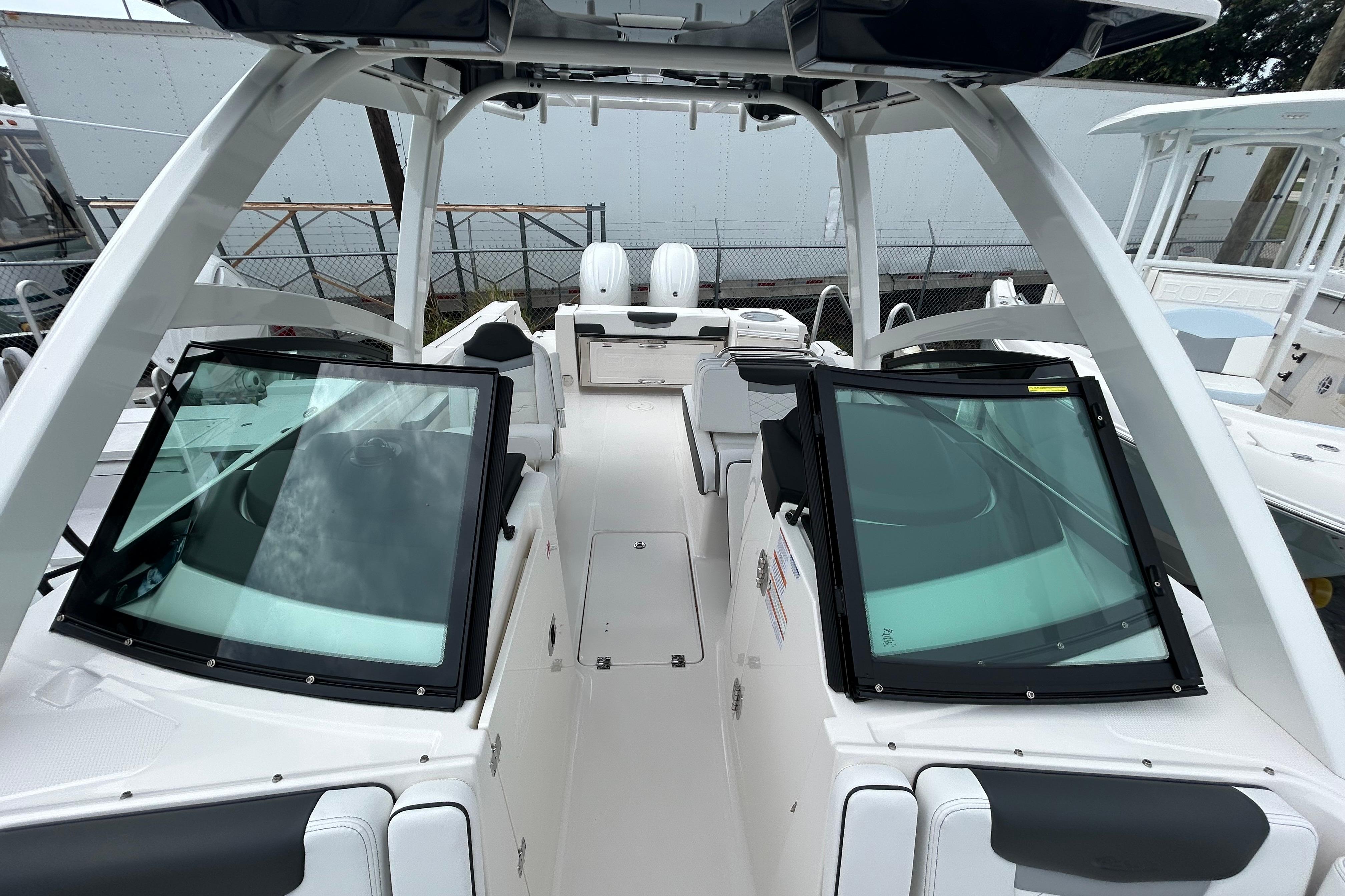 2026 Robalo R257 Dual Console boat interior with open windshield and seating.