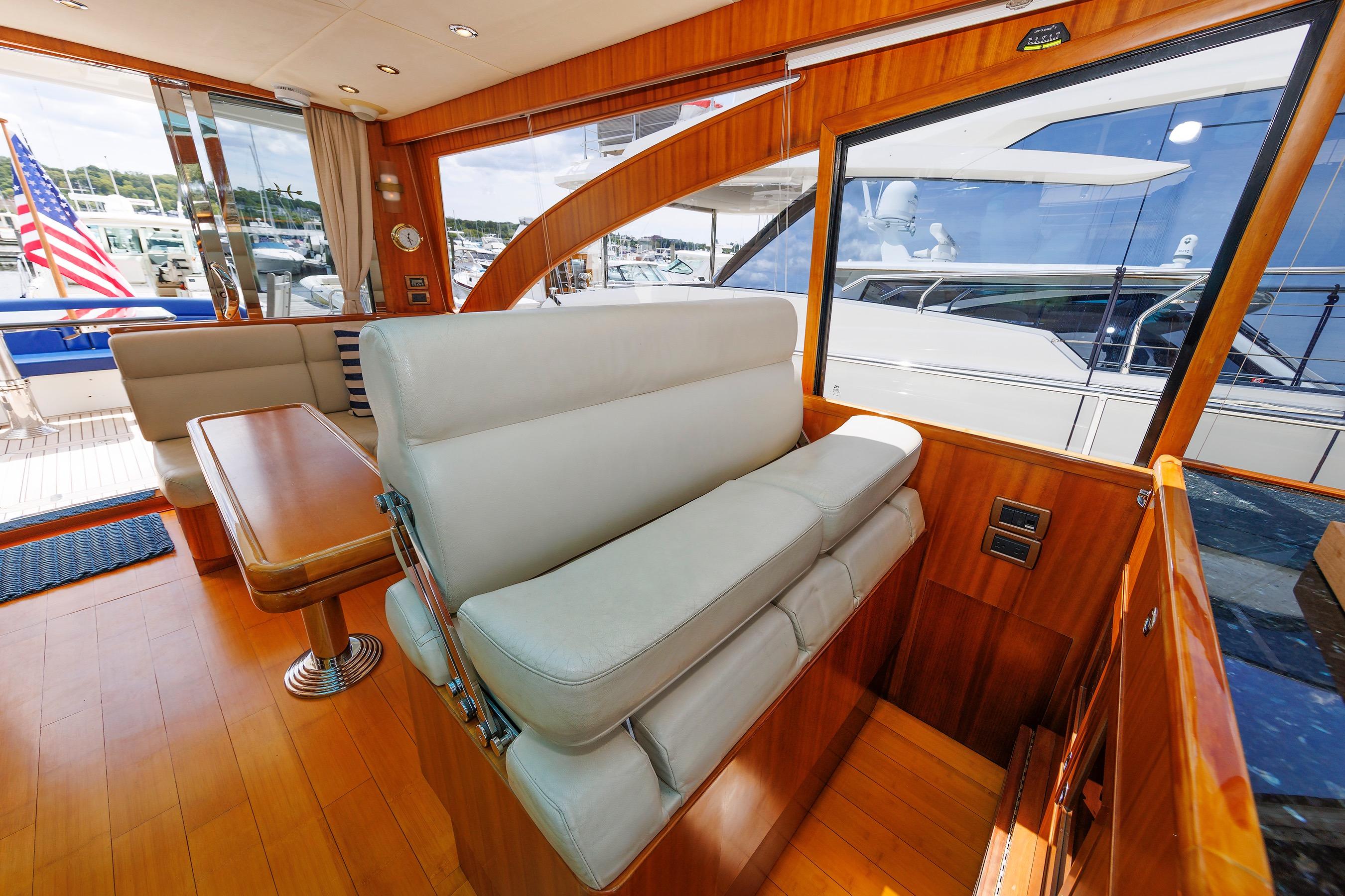 Luxurious interior of 2009 Hunt Yachts 52 Express with elegant seating and wooden finishes.