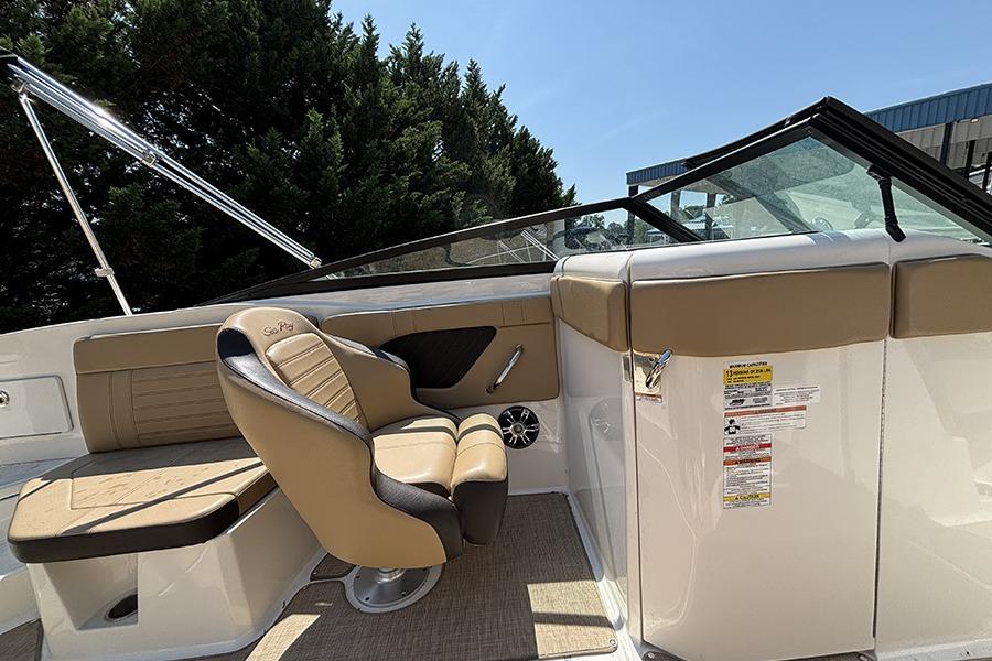 2019 Sea Ray SPX 230 Outboard interior with tan seating and sleek design.