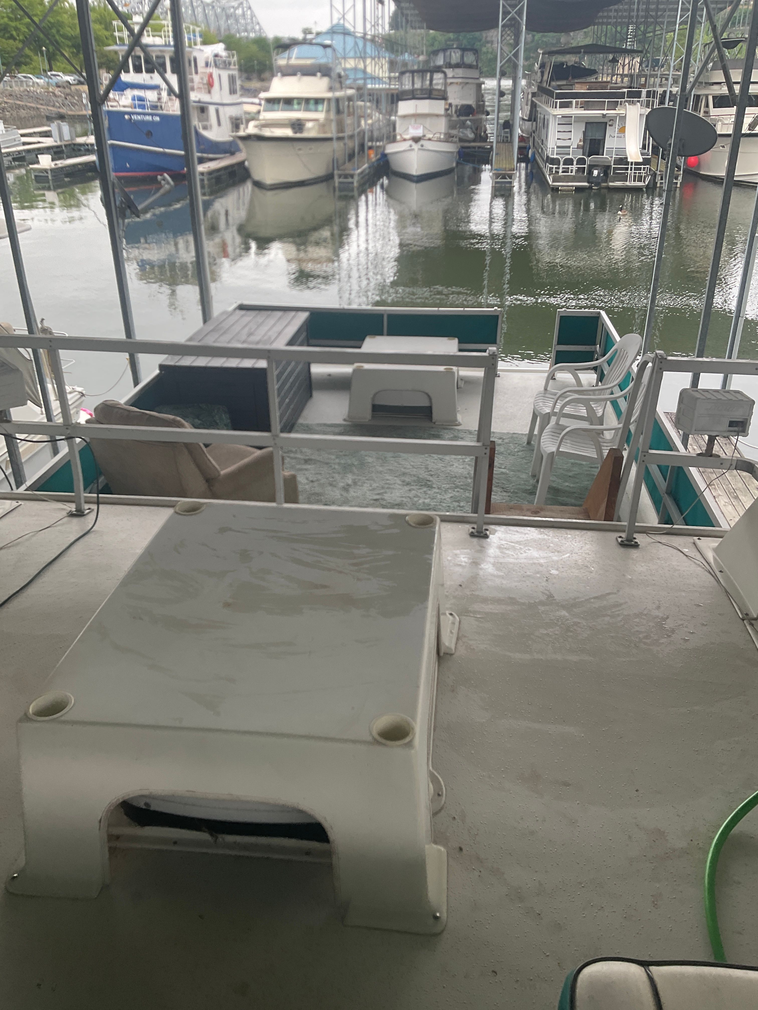 The image shows the deck of a 1996 Gibson 44 Standard docked in a marina.