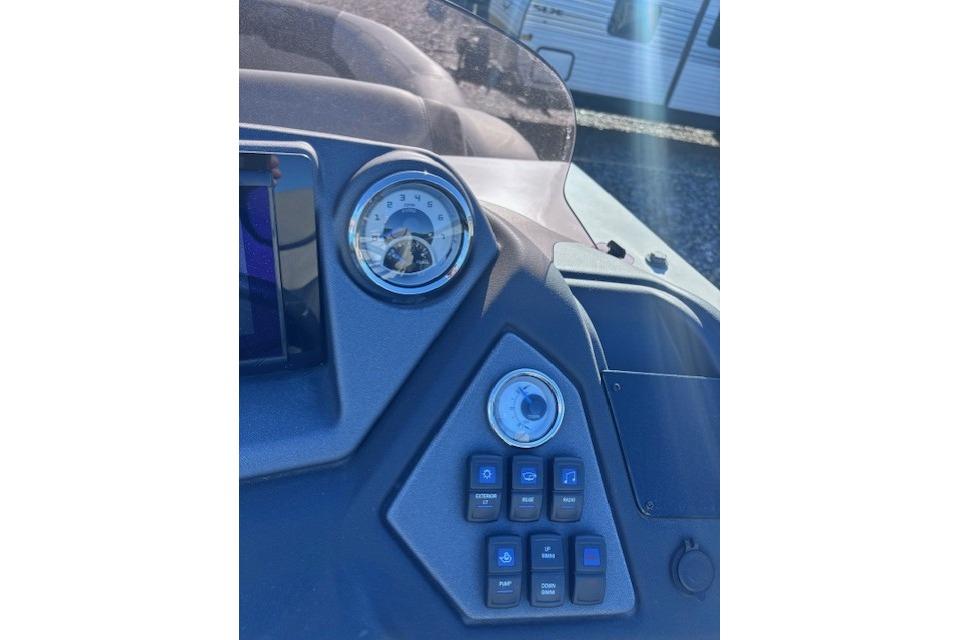 Dashboard of 2022 Sylvan L3 DLZ Bar boat with gauges and control buttons.