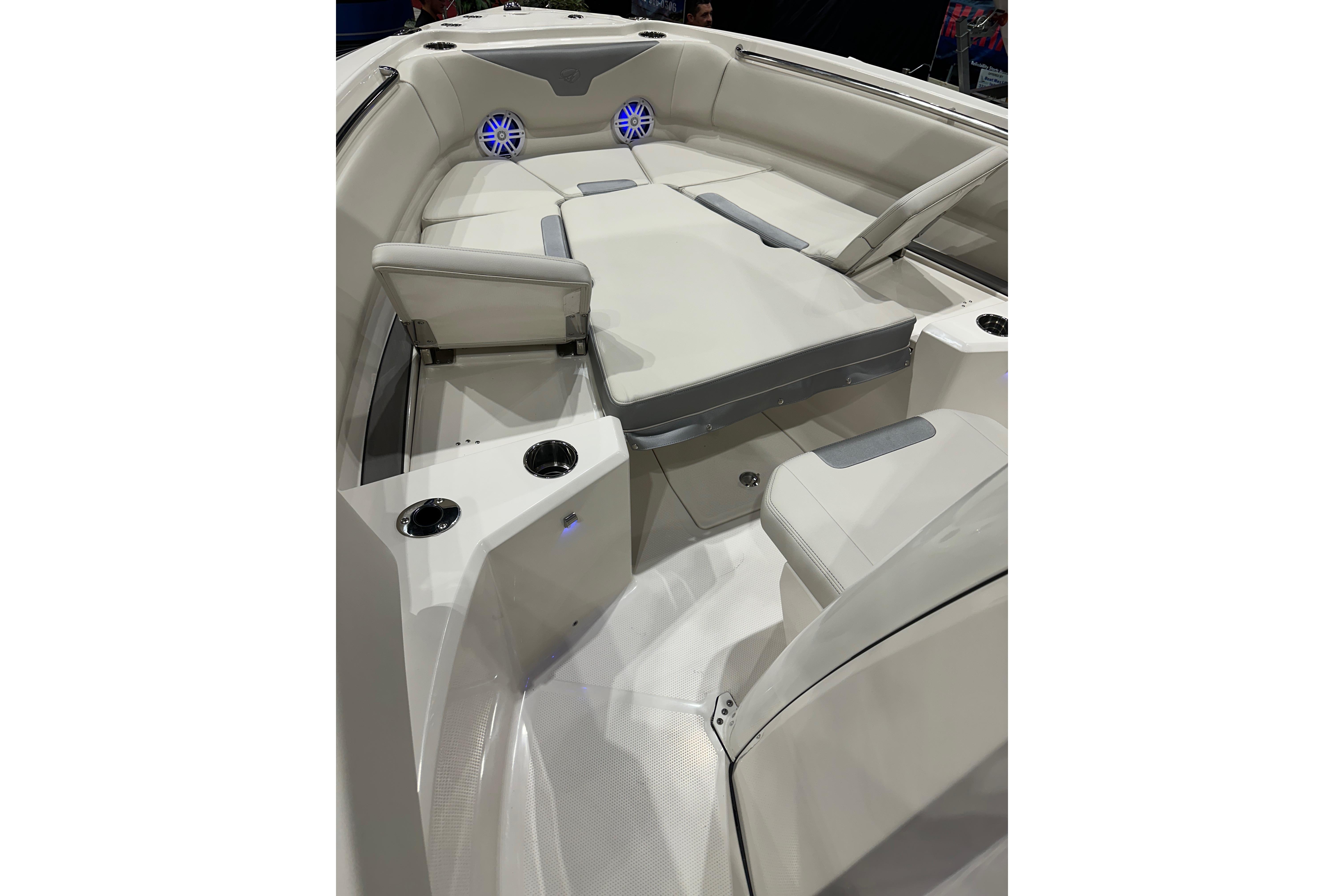 2026 Sailfish 232 CC boat interior with cushioned seating and cup holders.