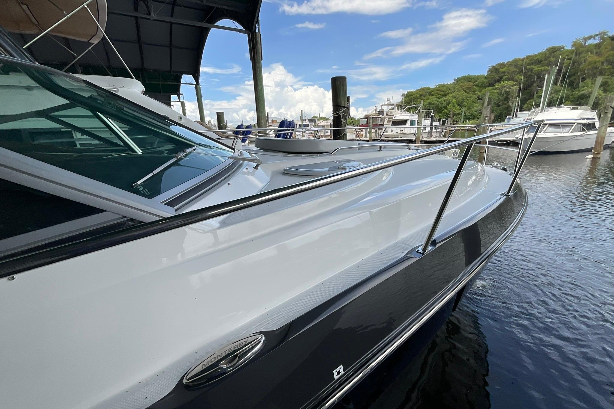 2019 Monterey 335 Sport Yacht docked at marina under clear blue sky.