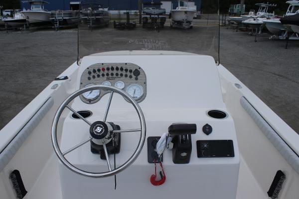 2025 Carolina Skiff 23 LS boat dashboard with steering wheel and control panel.