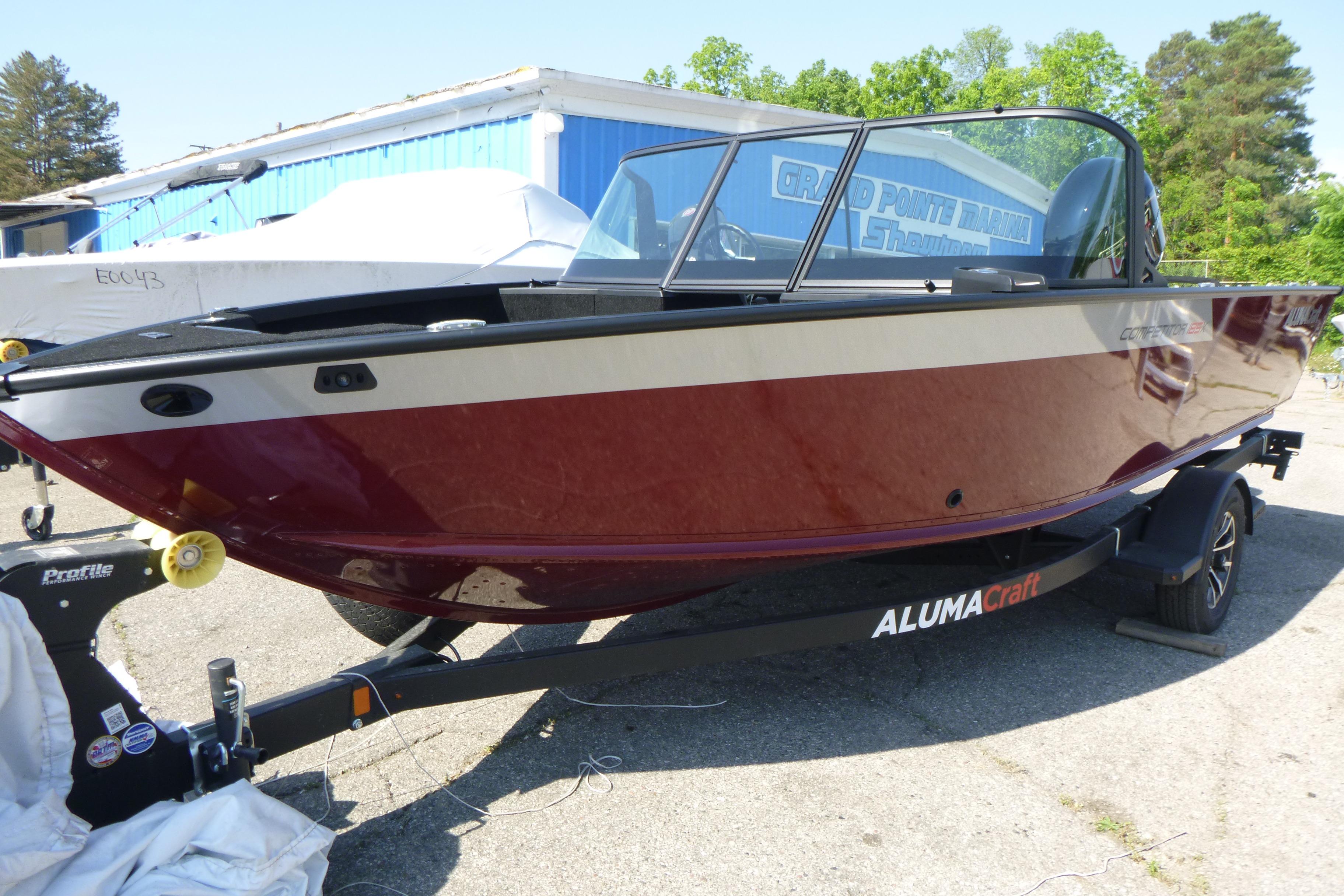 2024 Alumacraft Competitor 185X Sport boat on trailer, red and white exterior.