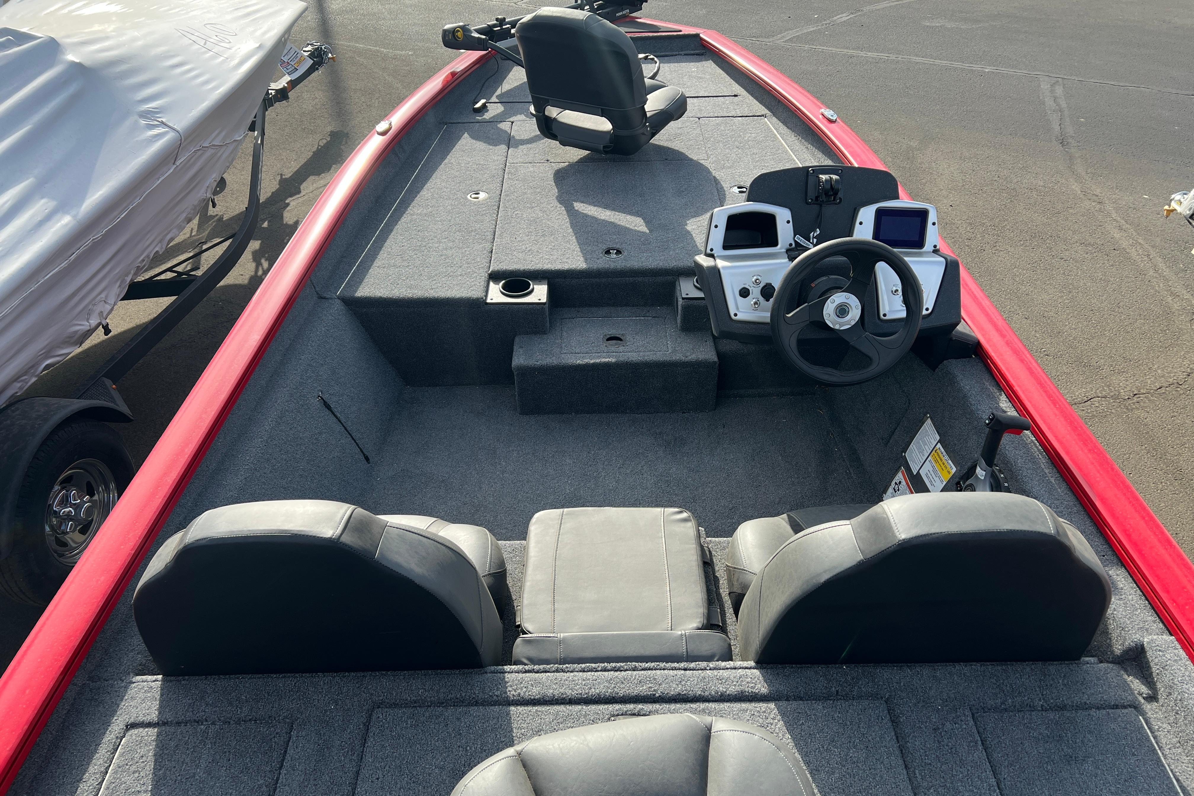 2026 Tracker Pro Team 190 boat interior with dual consoles and seating, featuring a red trim.