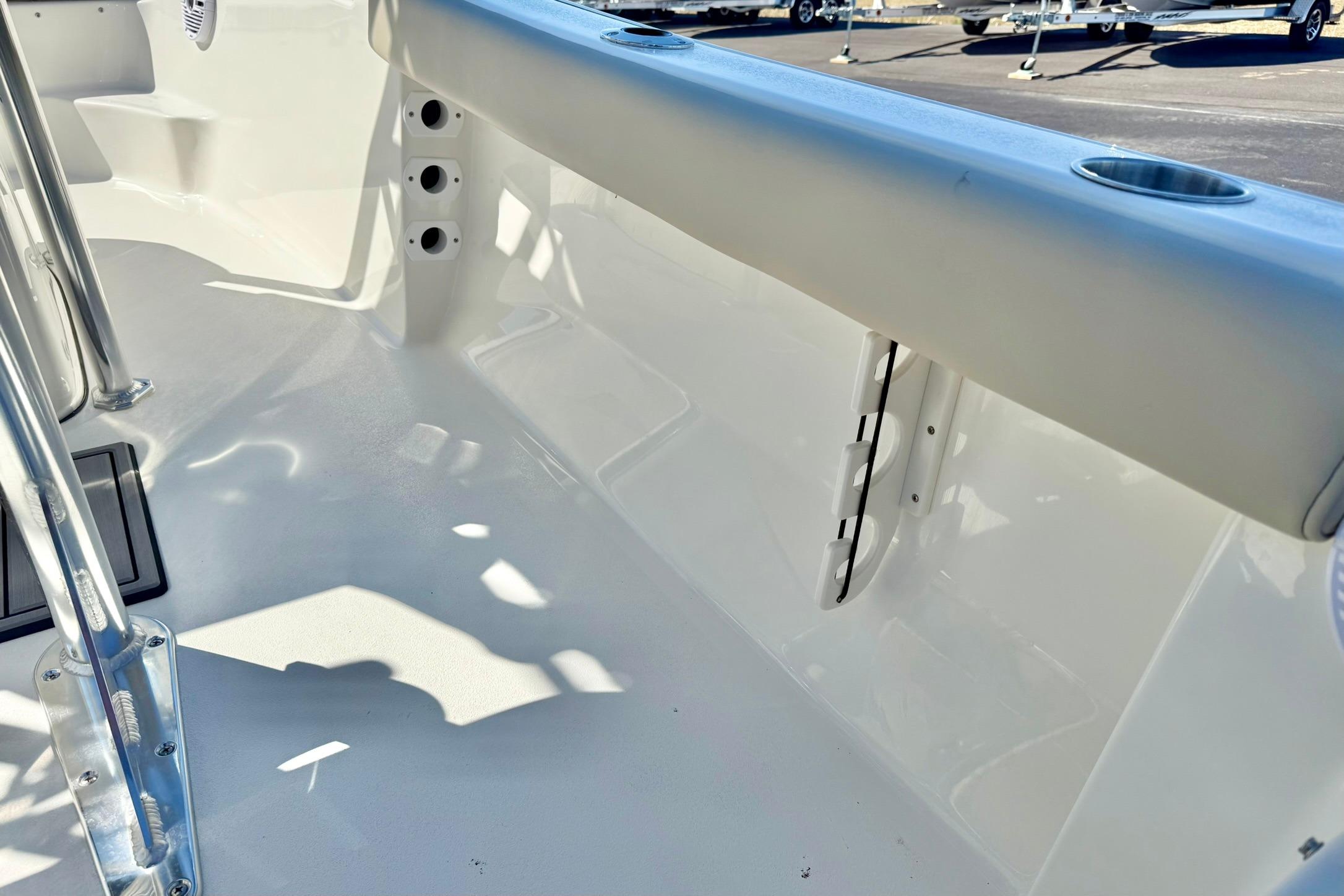 Interior view of a 2026 Key West 189 FS boat, showcasing sleek design and cup holders.