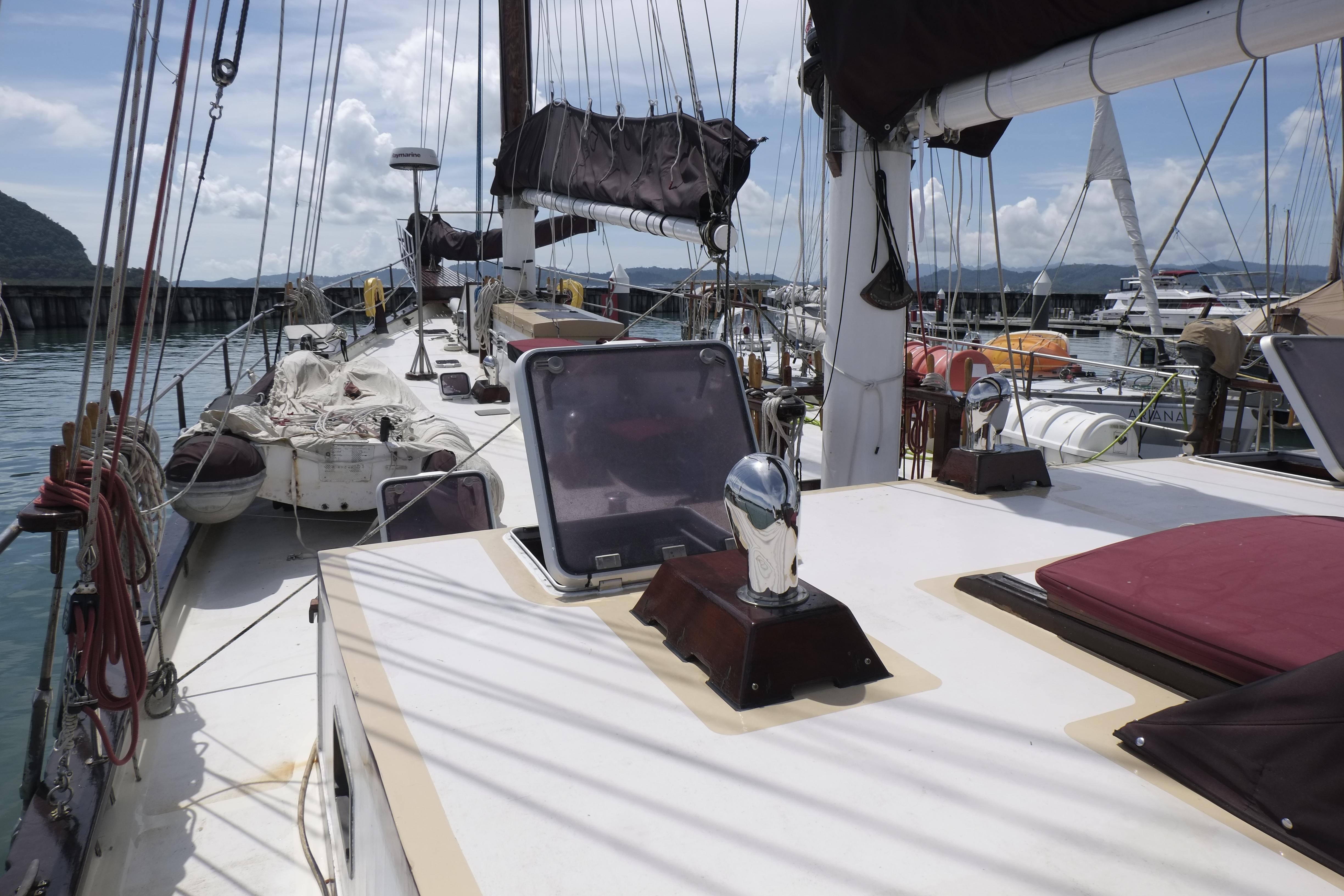 Custom Bud Macintosh schooner, 2006, docked at marina with clear skies and calm waters.