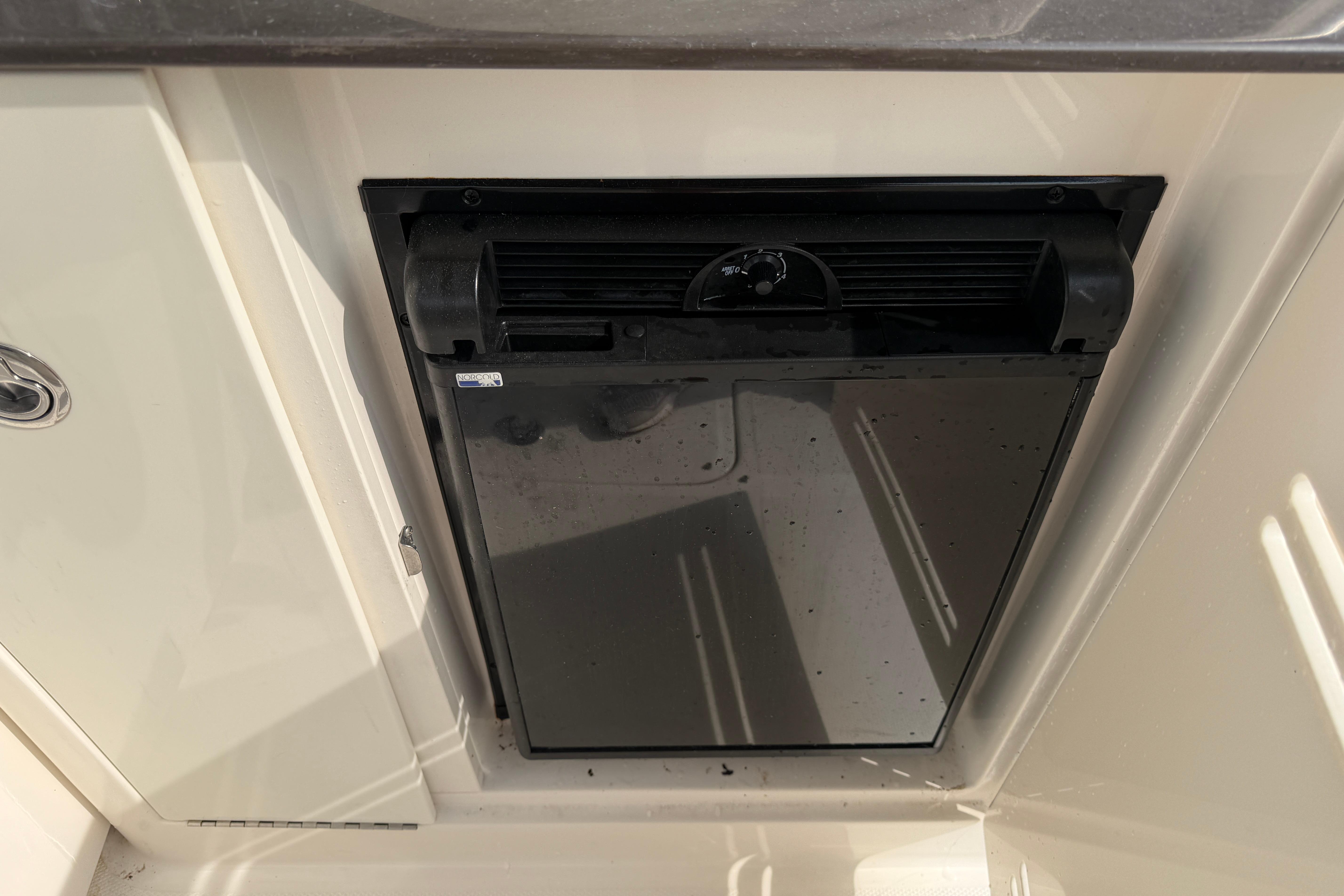 Built-in refrigerator on 2013 Sea Ray 300 SLX boat.