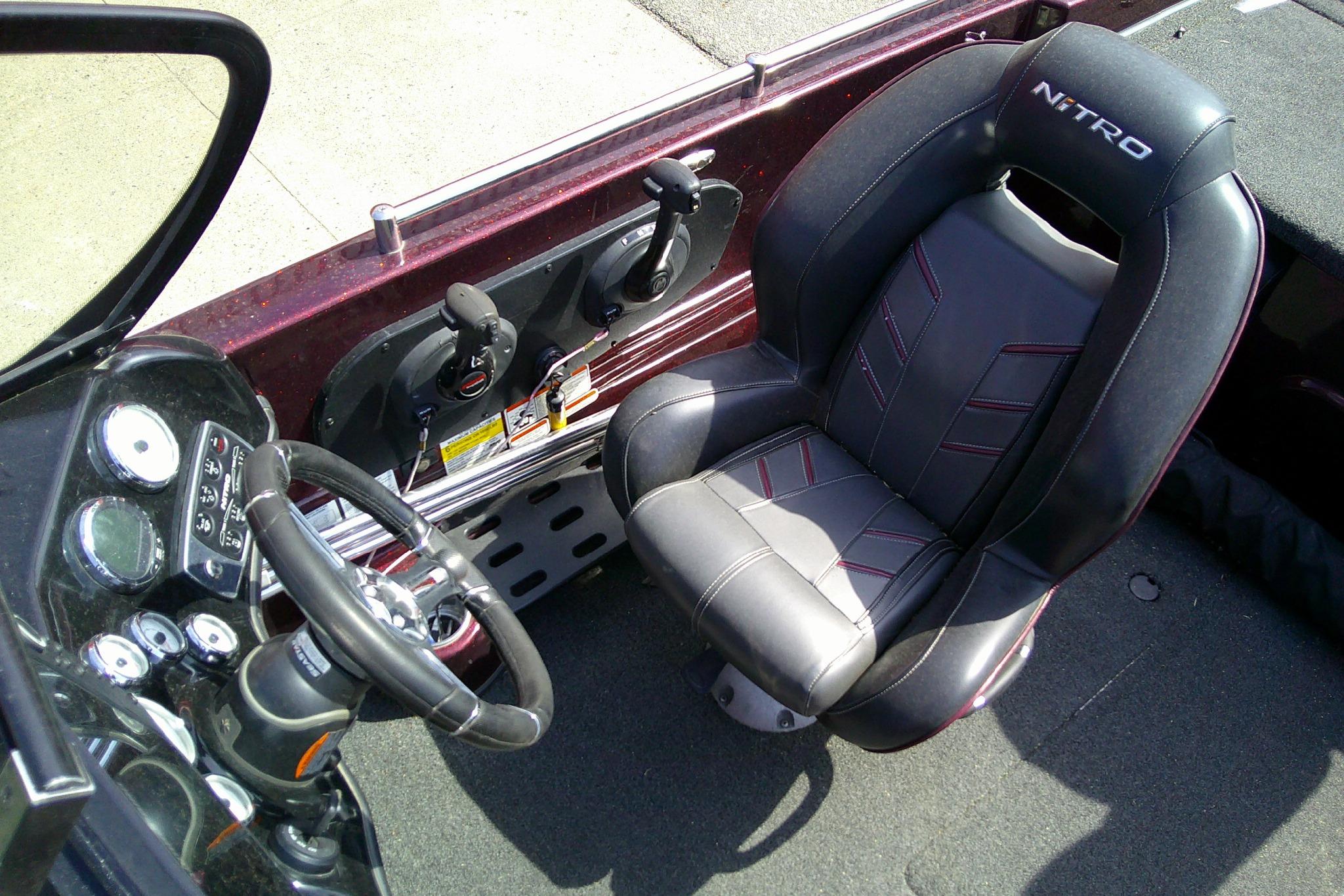 2019 Nitro ZV19 Sport boat interior with steering wheel and cushioned seat.