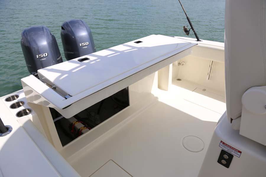 Manufacturer Provided Image: 2022 Cobia 262 Center Console boat with twin 150 HP engines on water.