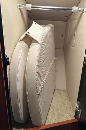 Cushions stored in a cabinet on a 2004 Sea Ray 380 Sundancer boat.